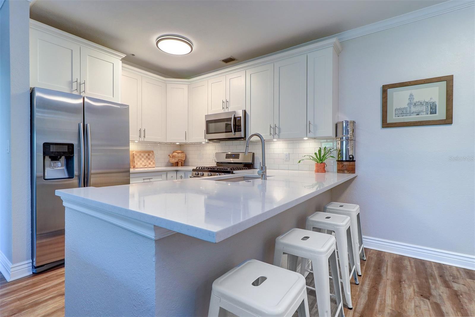 Close up of kitchen island and wrap around kitchen
