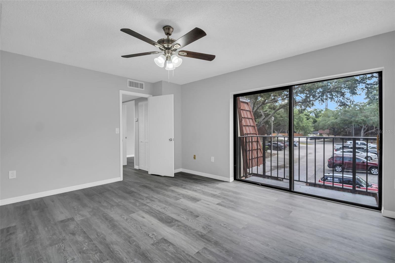 Primary Bedroom with Sliding Glass Doors and Balcony