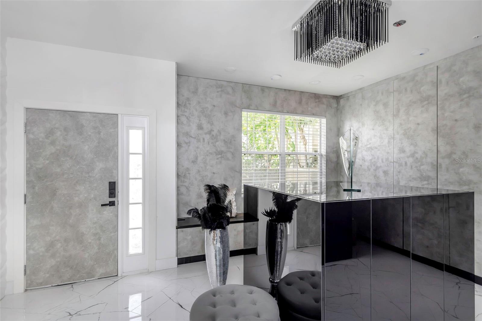 Great room with the entire wall of closets on the first floor