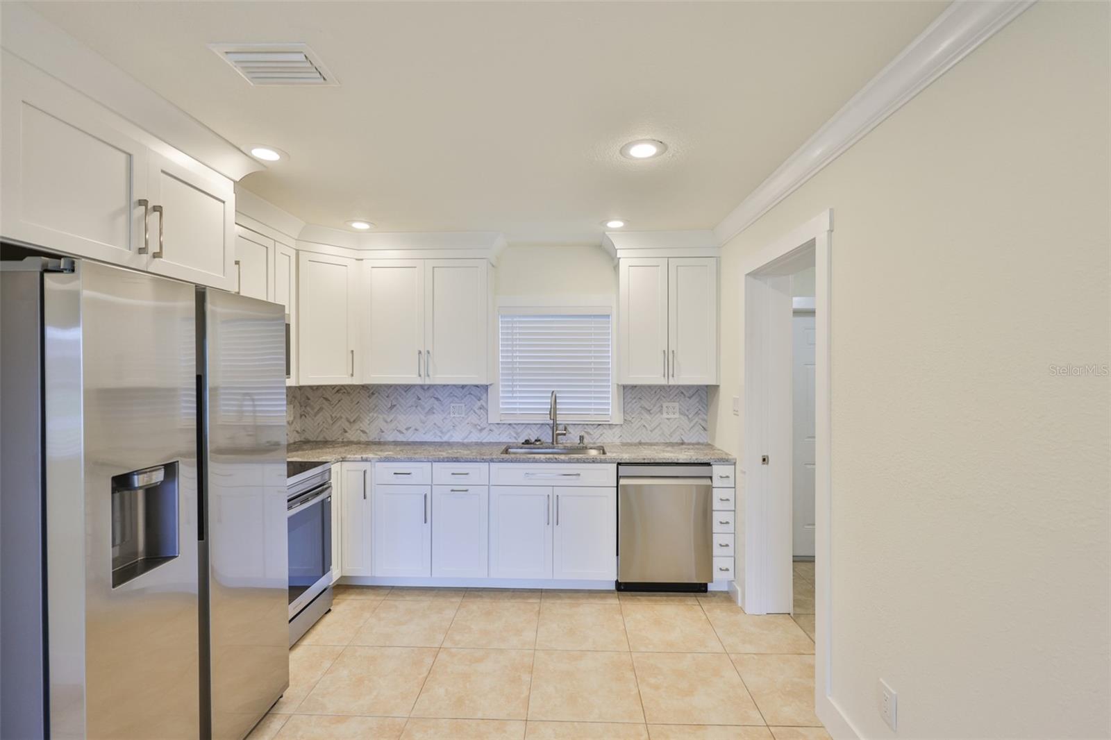 beautiful new spacious kitchen with stainless appliances
