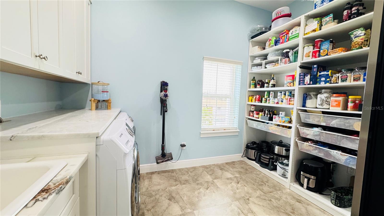 Large walk-in pantry/laundry room.