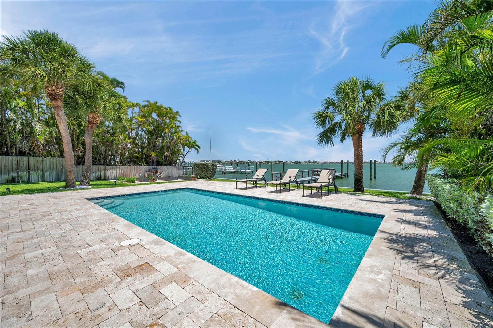 Saltwater pool and travertine pool deck.
