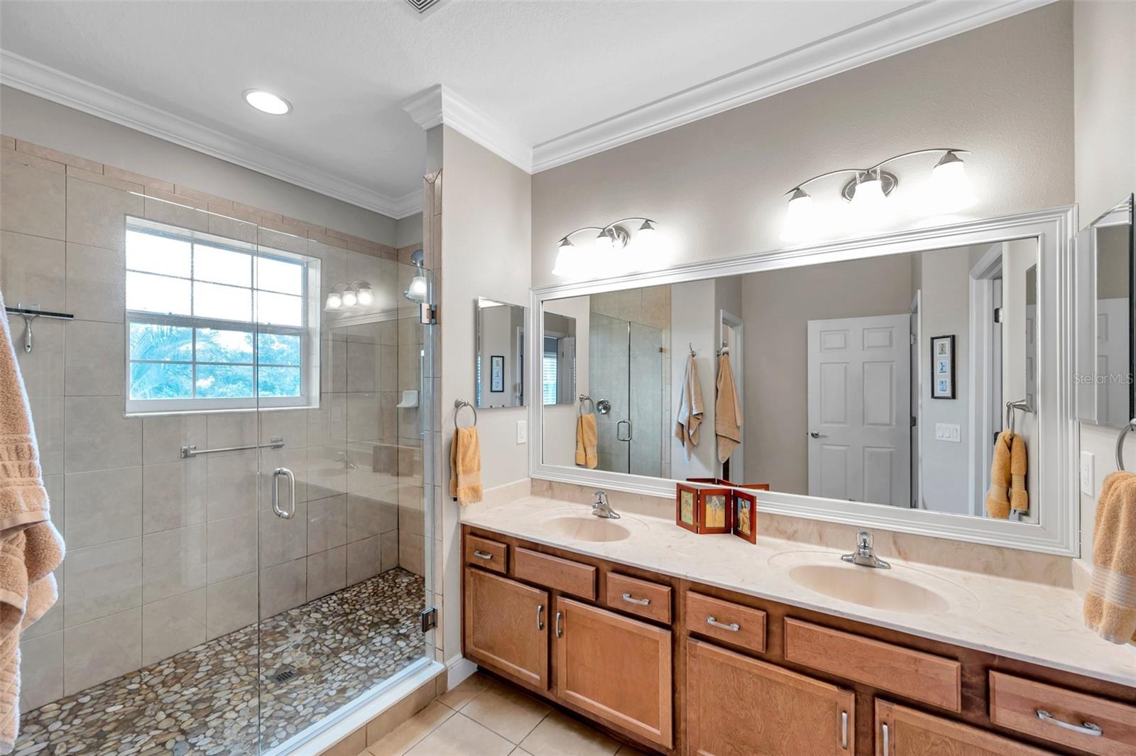 beautiful shower and  dual sinks