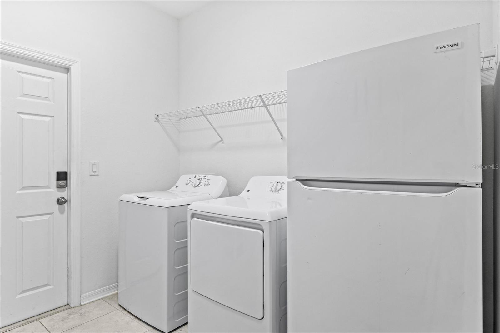 Laundry Room.  White refrigerator DOES NOT CONVEY