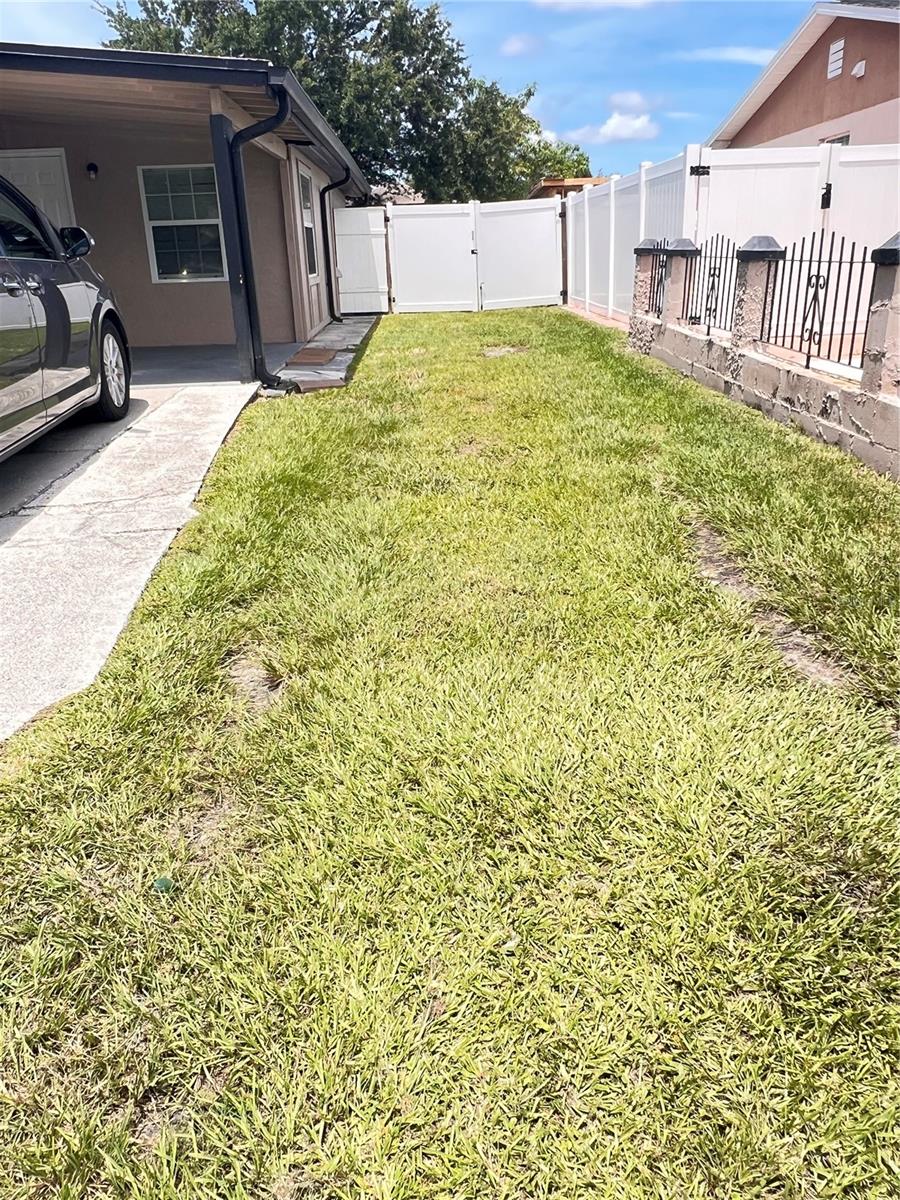 right front yard to double gate to backyard