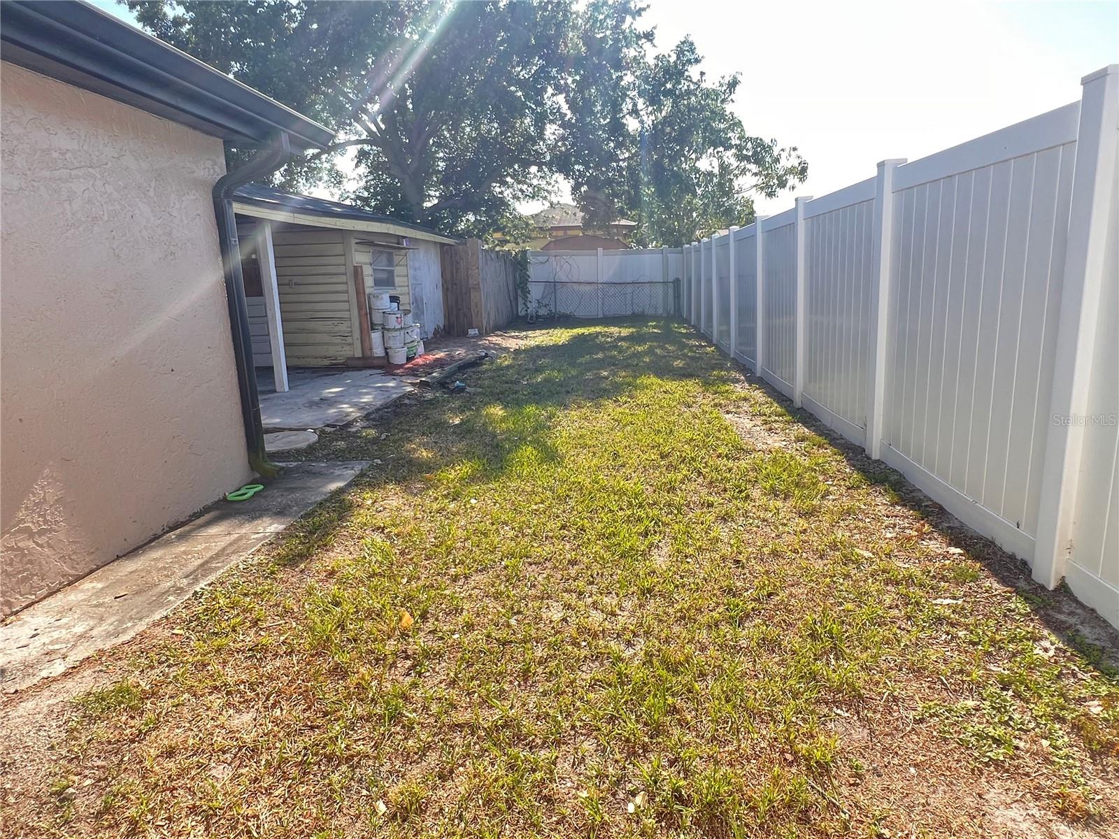right side of backyard to outside storage building
