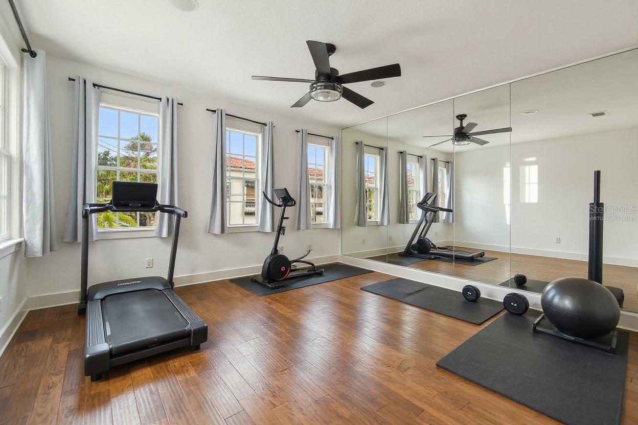 Virtually staged detached 3rd bedroom as private home gym