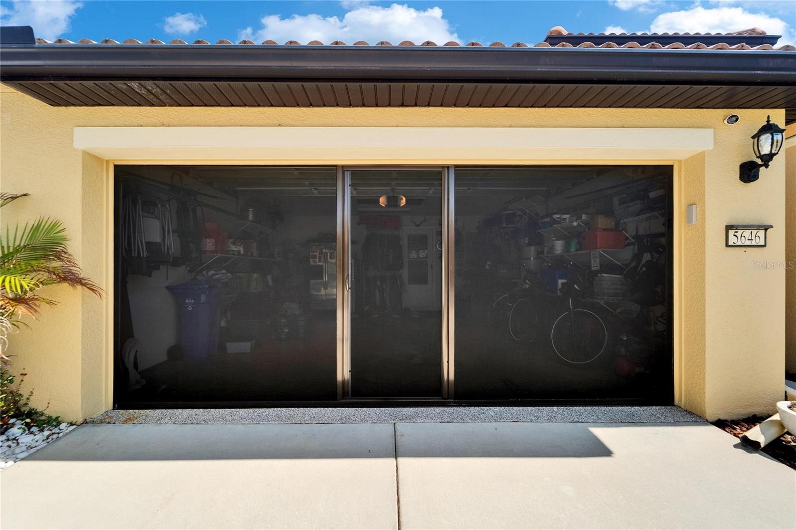 Screened garage door