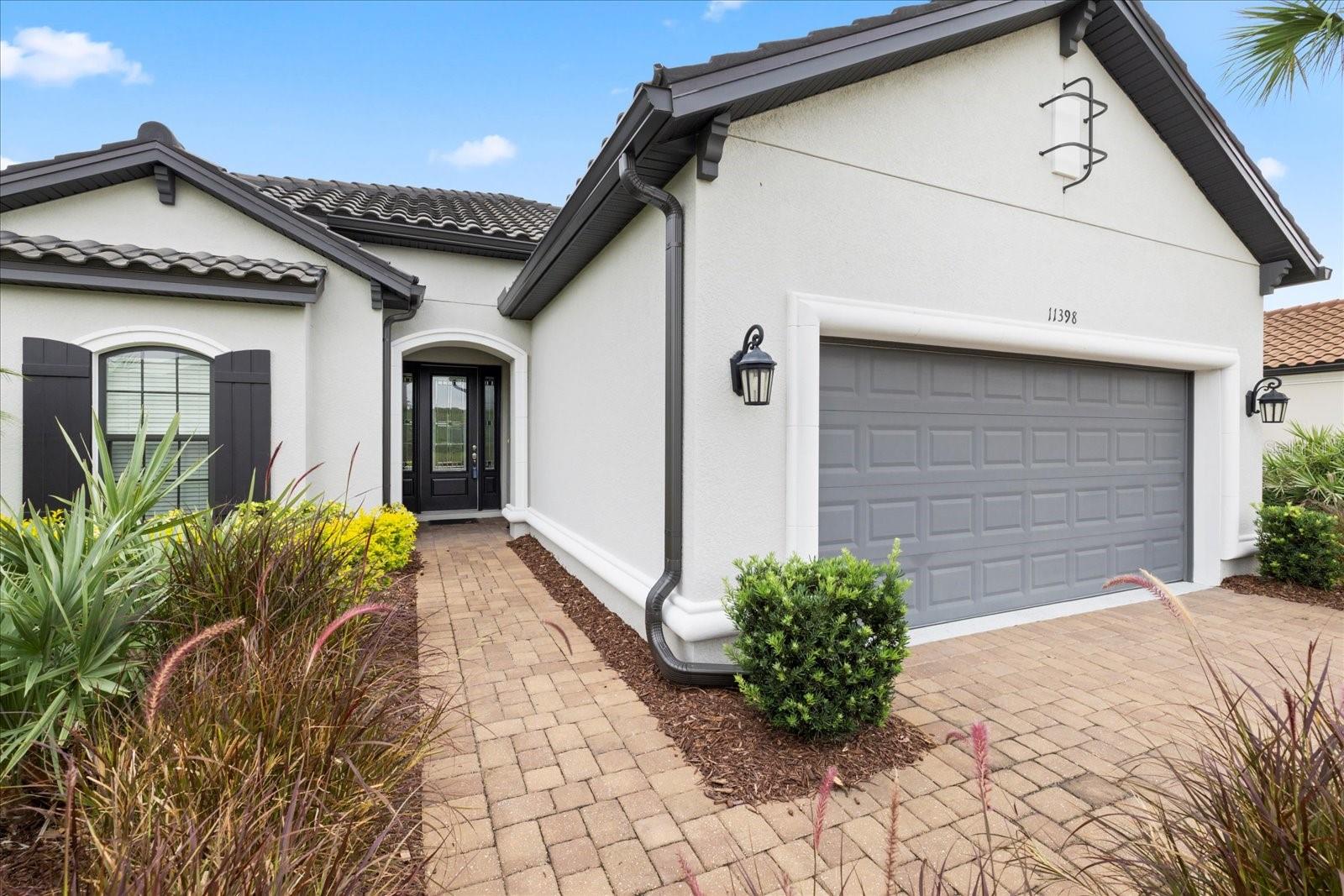 Entry walkway with prestine landscaping