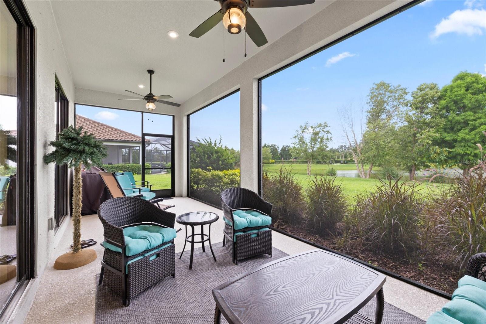 Screened lanai with ceiling fans for comfort