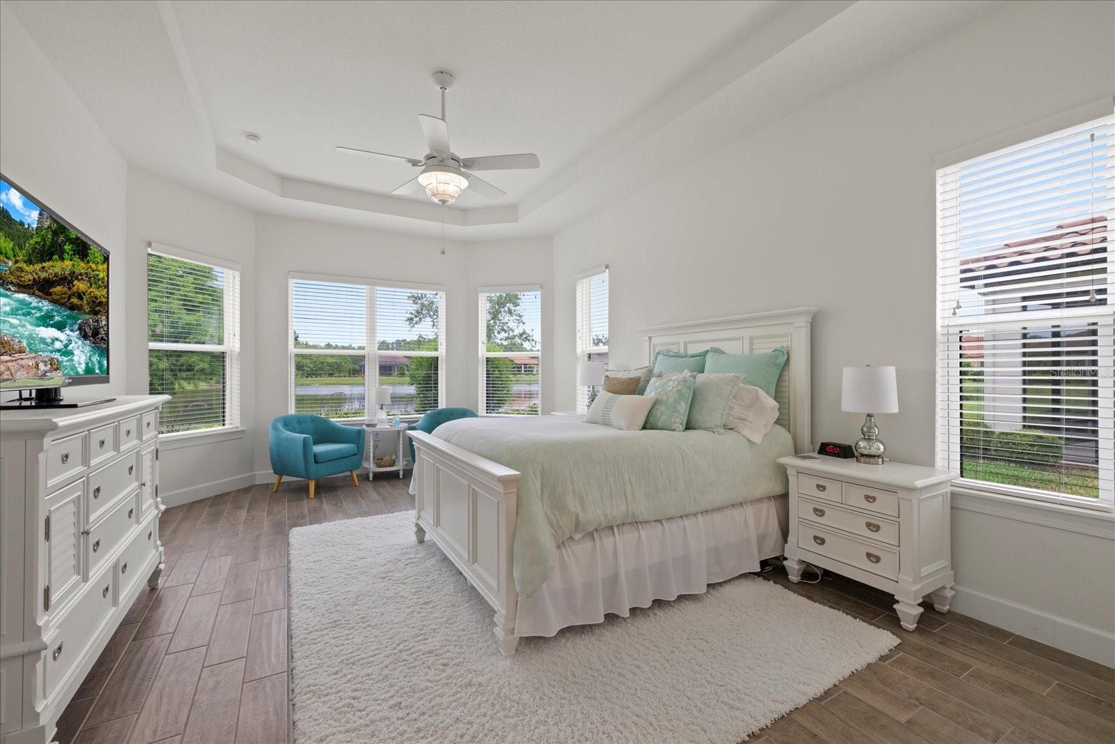 Primary bedroom with gorgeous water views of pond