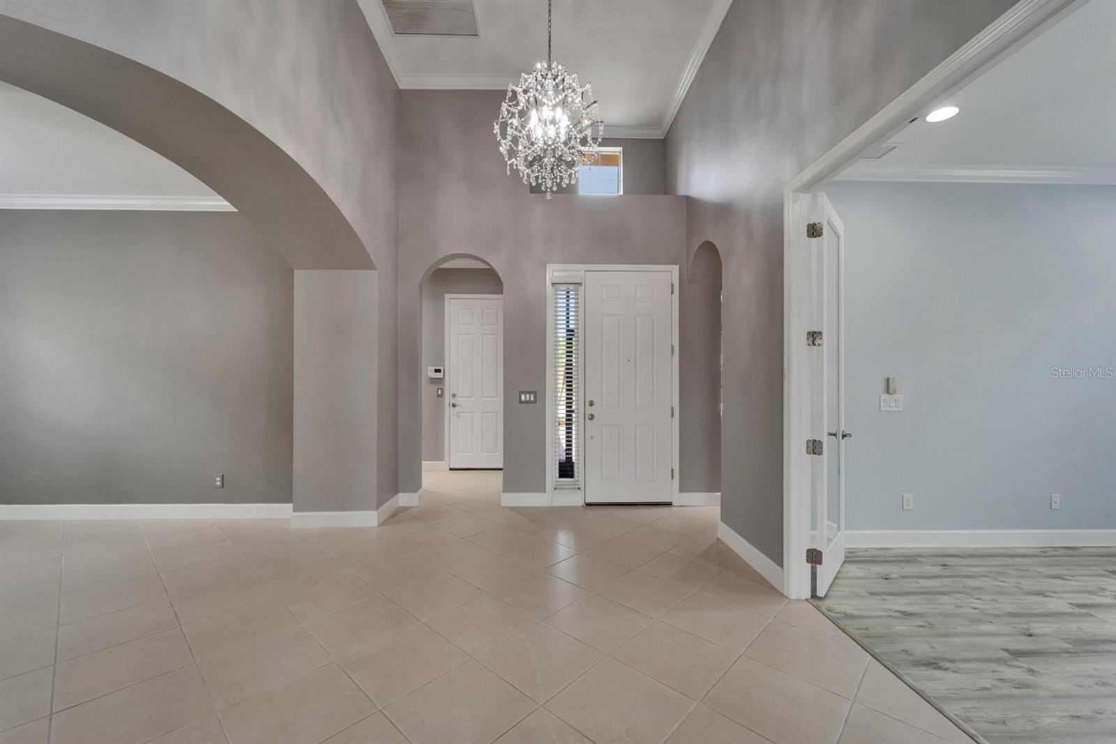 Walk into a 14-foot high ceiling with a beautiful crystal chandelier