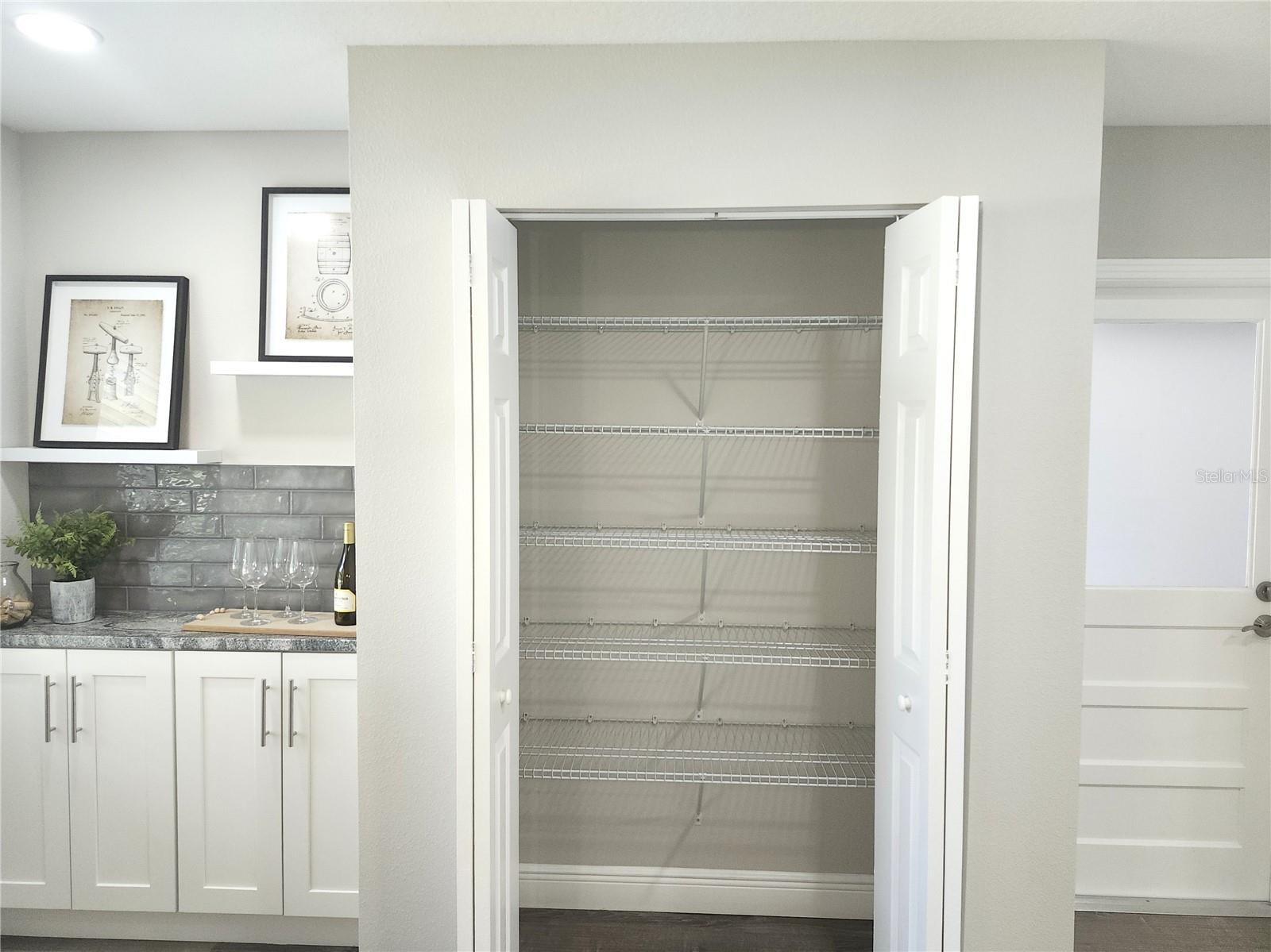 Large Double Door Pantry next to the garage access