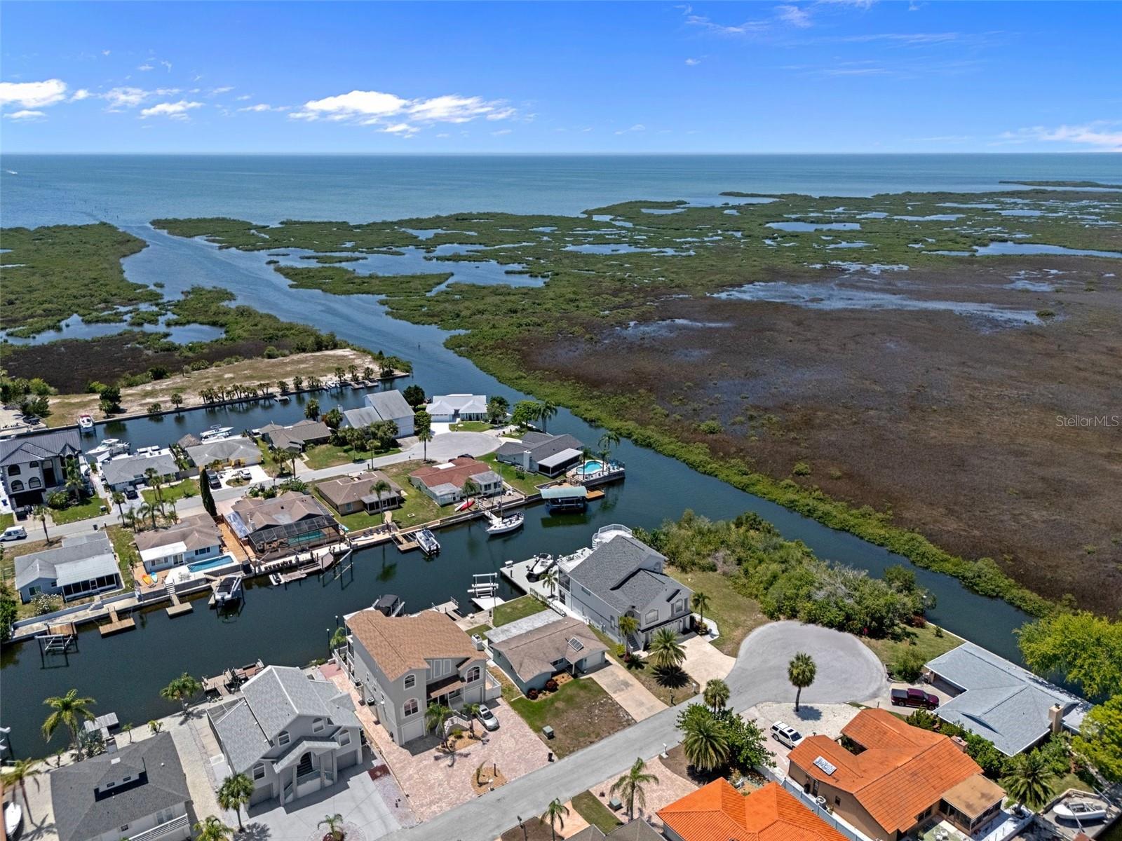 Looking west to the Gulf, the home is on a quiet street near the cul-de-sac and neighboring wetlands
