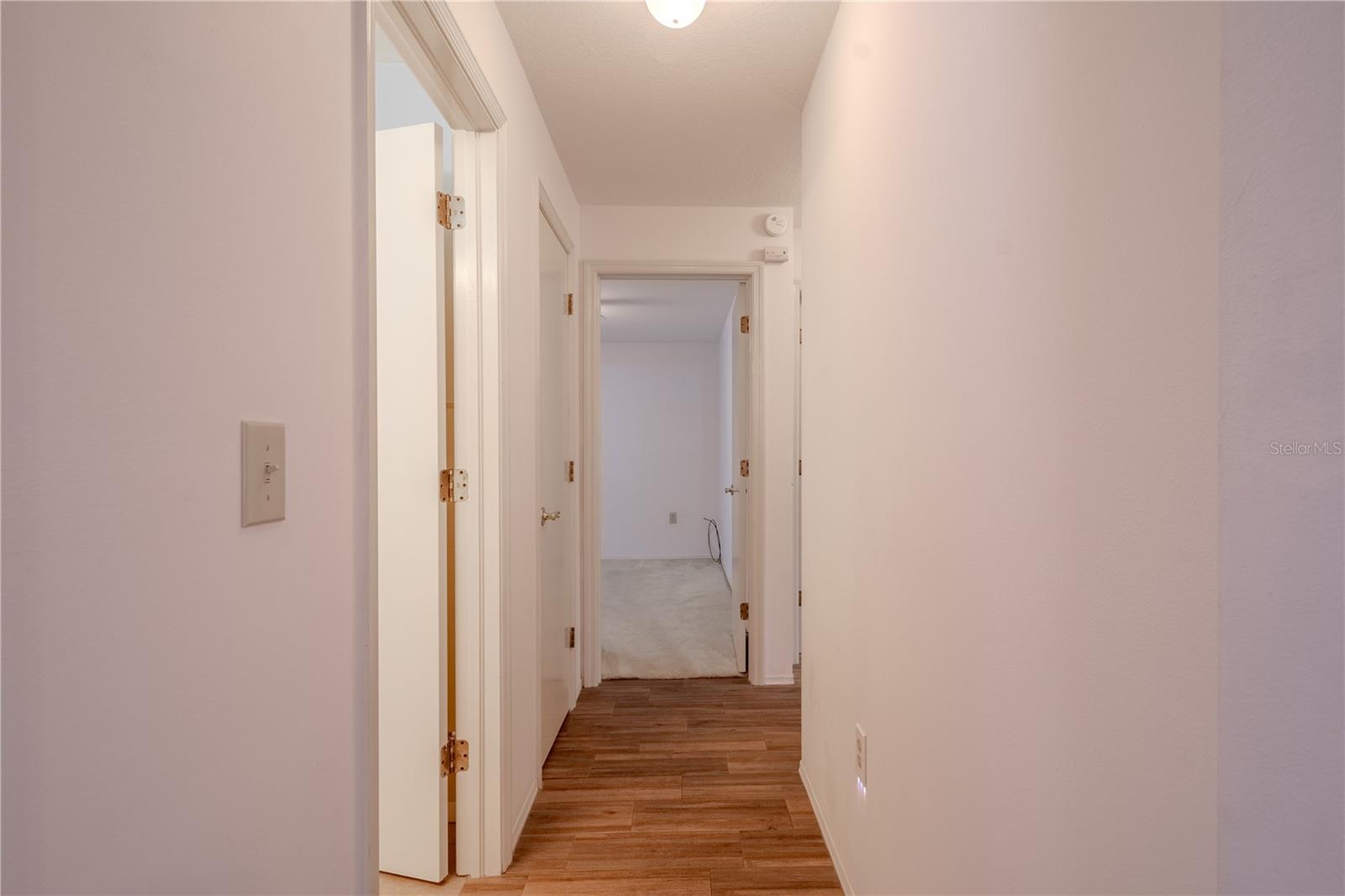 Split floor plan with hallway leading to 3 bedrooms