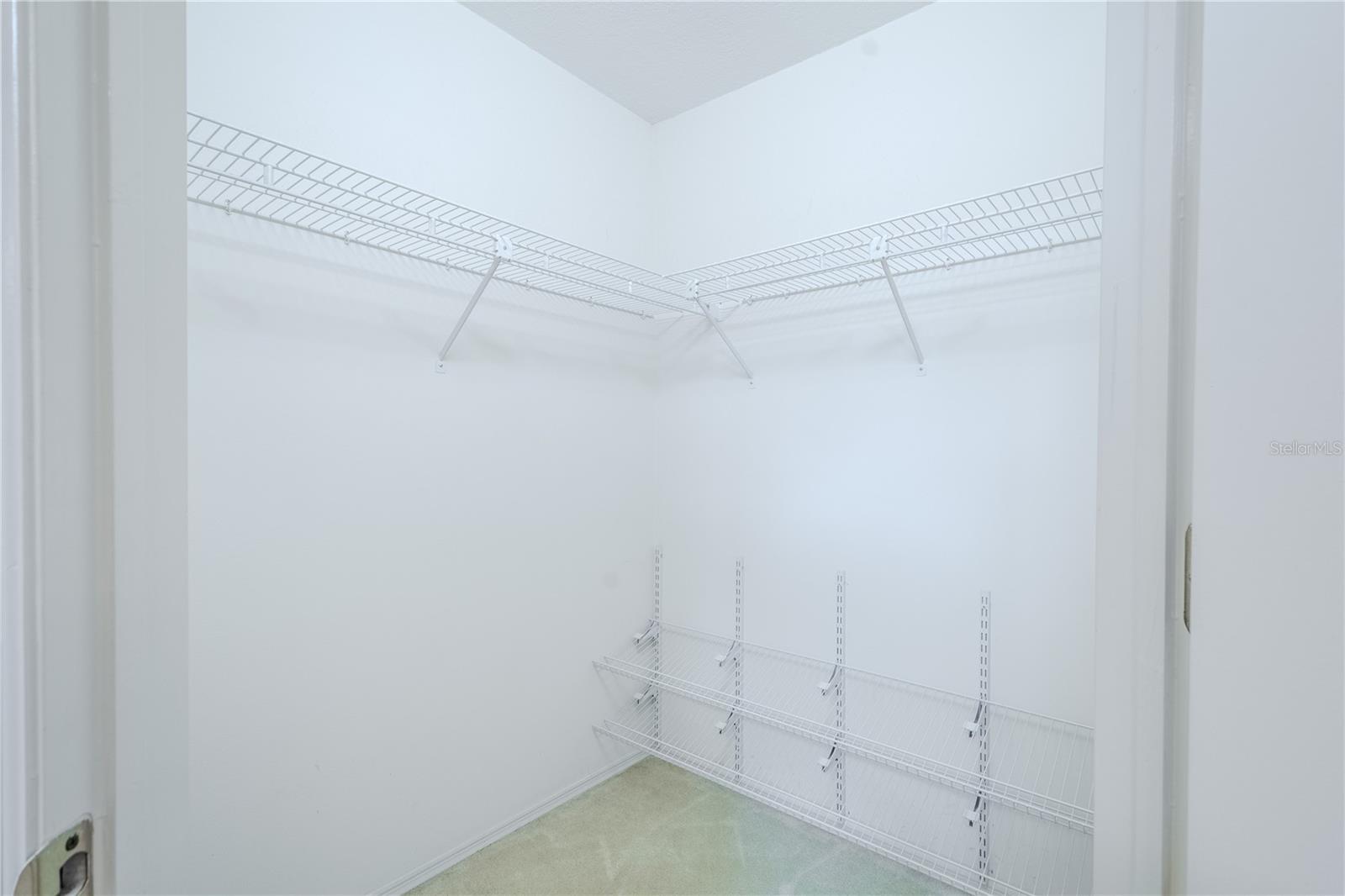 Primary His & her walk-in closets