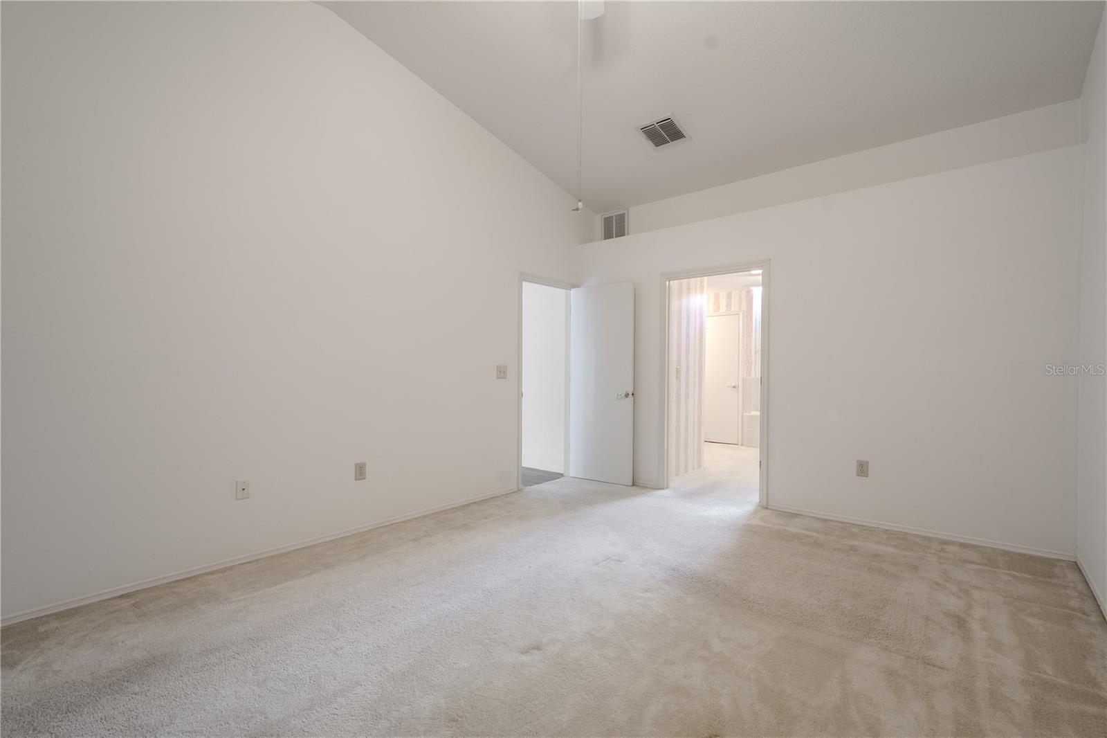 In the primary bedroom there’s ample room for a king-size bed and additional furnishings, and the layout provides a quiet separation from the main living areas for added privacy.