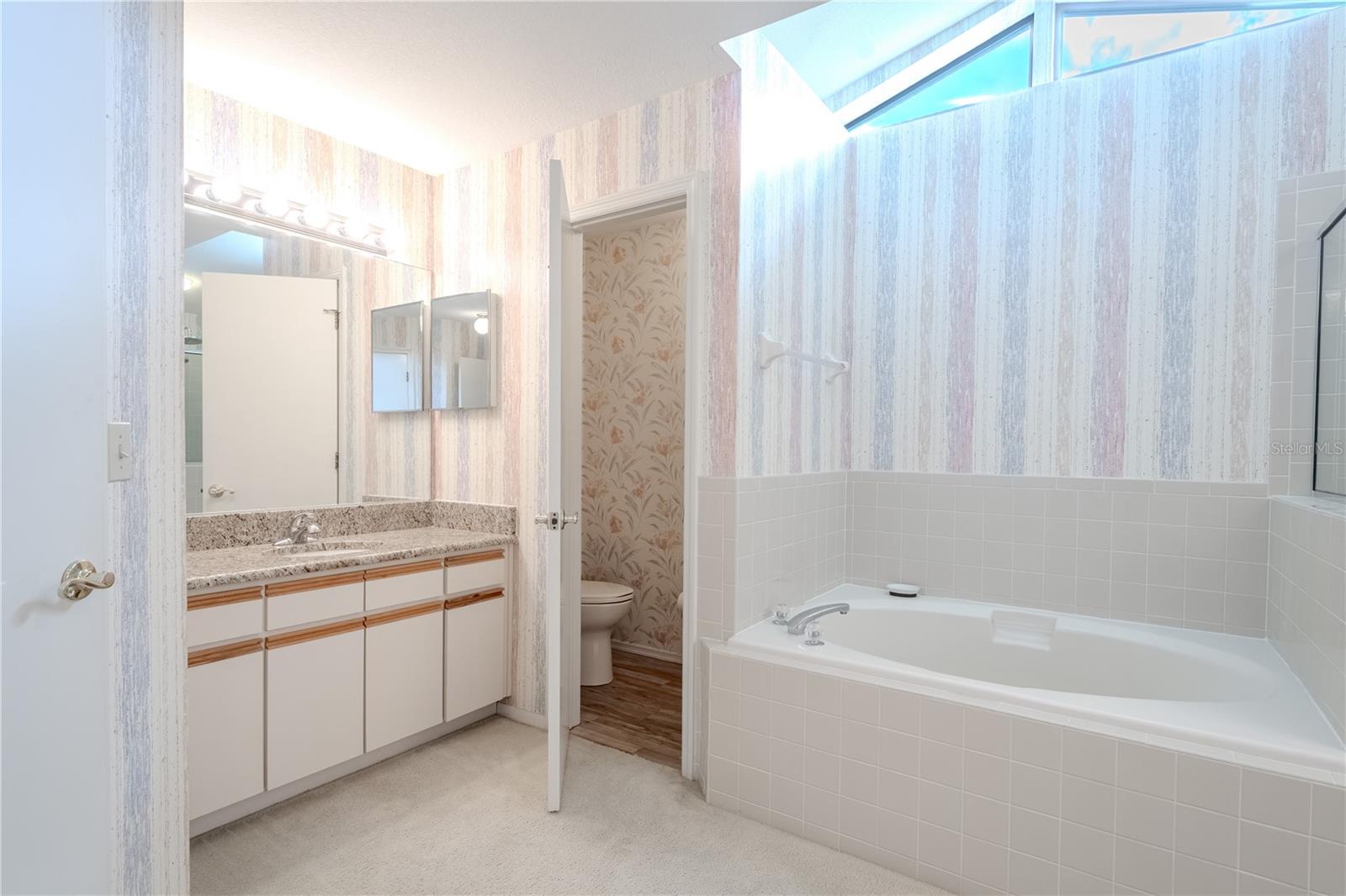 This primary ensuite offers both comfort now and exciting potential for future enhancements.