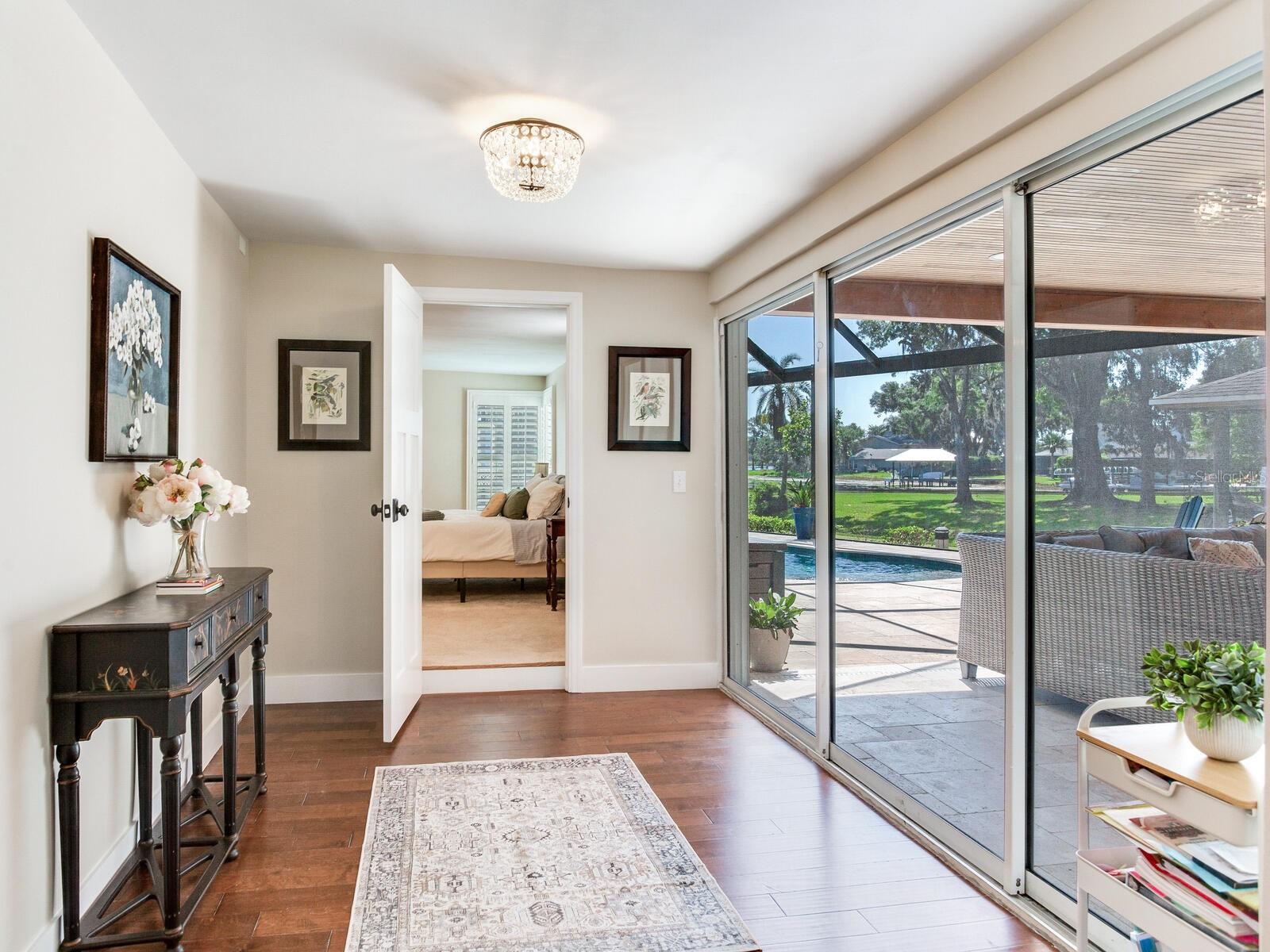 Downstairs Primary Suite Entrance / Sliding Door to Patio & Pool
