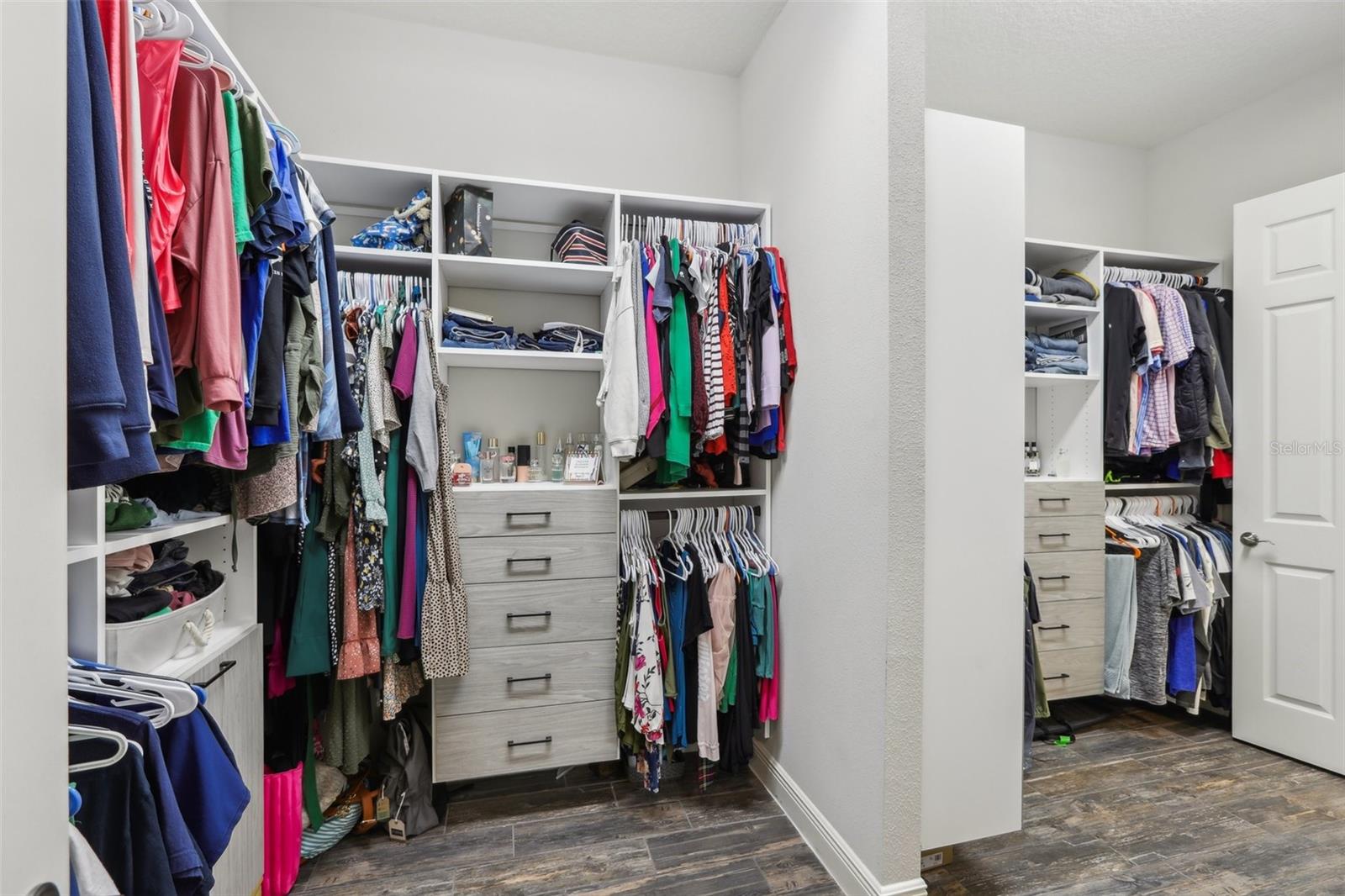 Primary Bedroom Closet with upgraded built-ins