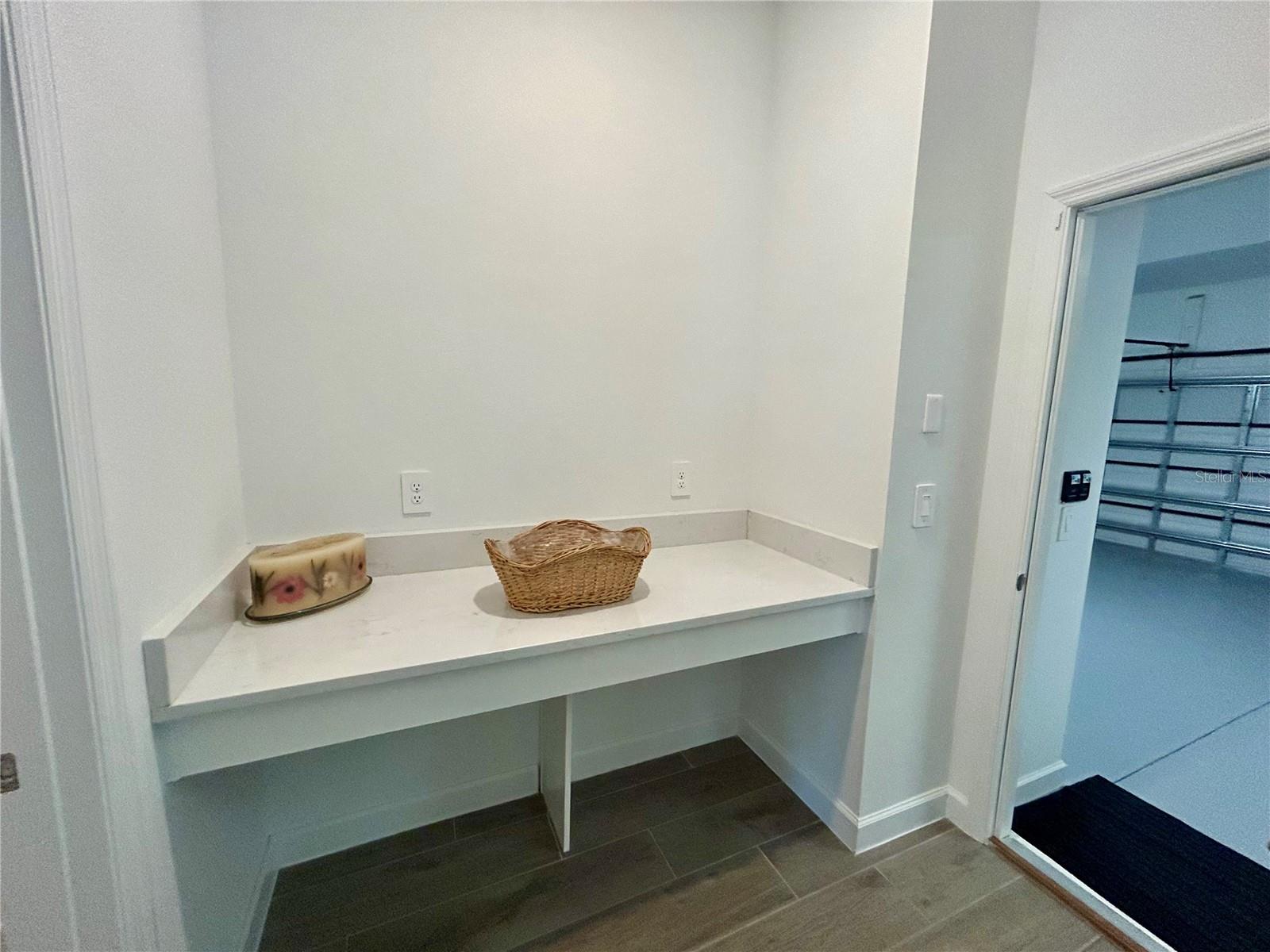 Foyer Folding Area between  Laundry Area and 18x20 Garage