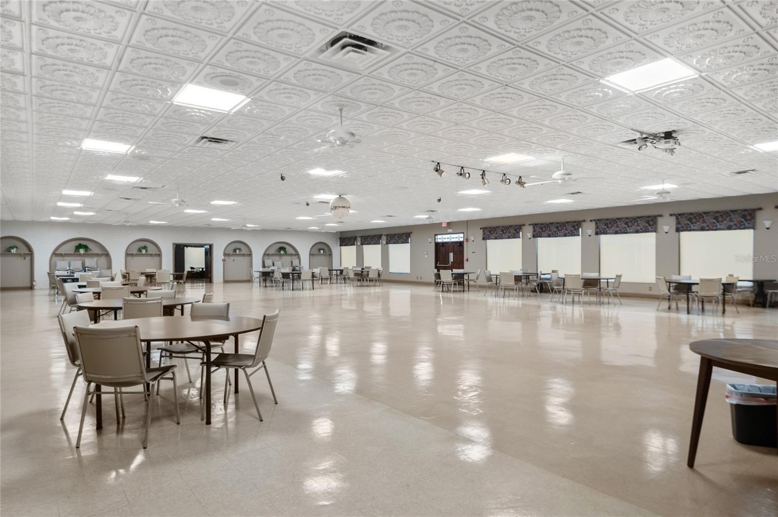 Auditorium with stage, full kitchen, and connected lounge offers space for meetings, dances, parties, and more