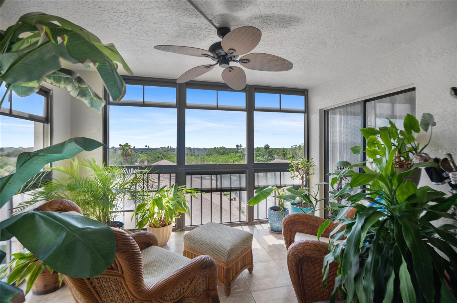 Watch the sunrise from the tiled and screened lanai (can be closed in) accessible from bedroom and living room