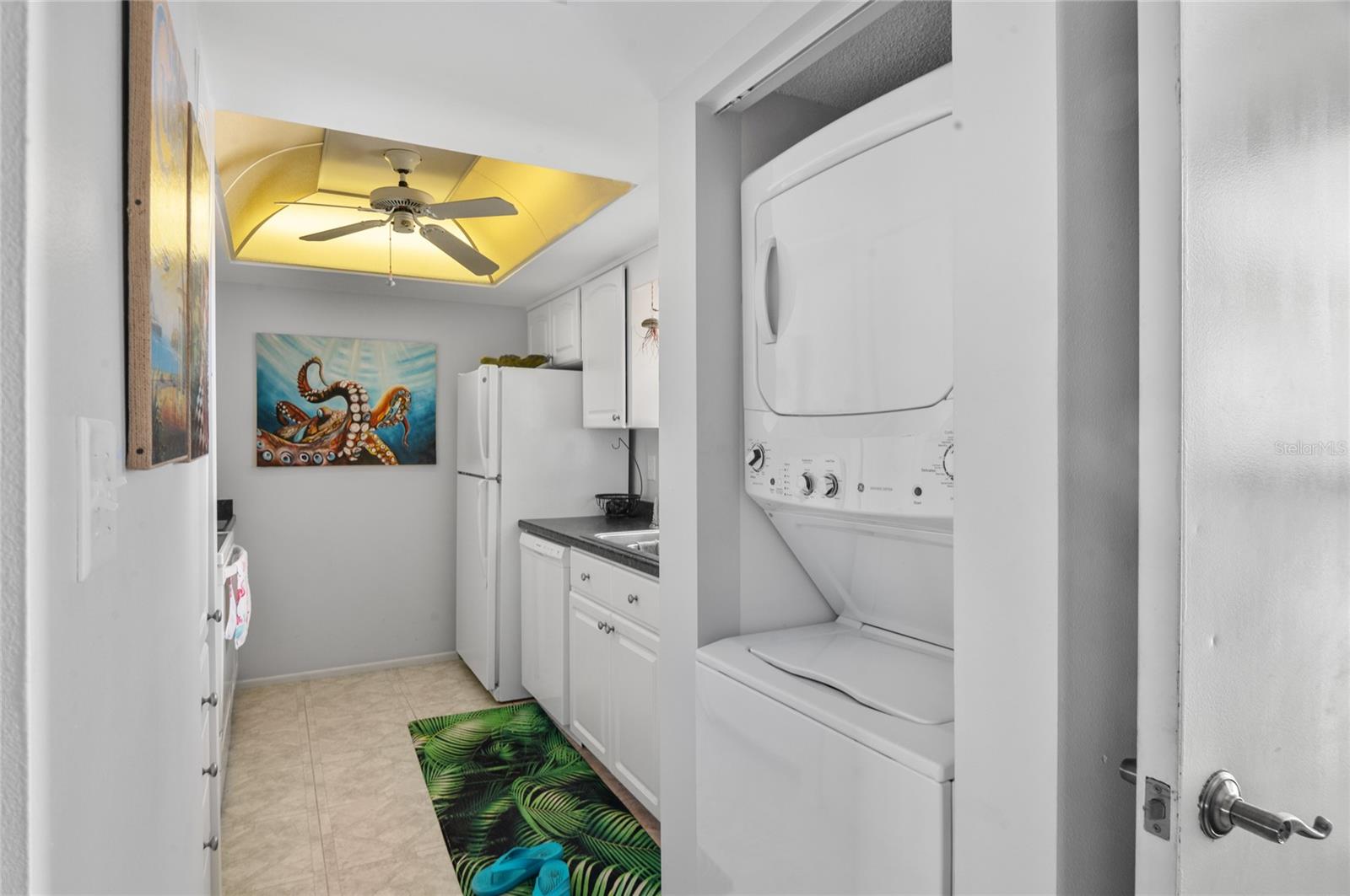 Kitchen features a FULL SIZE stacked washer and dryer