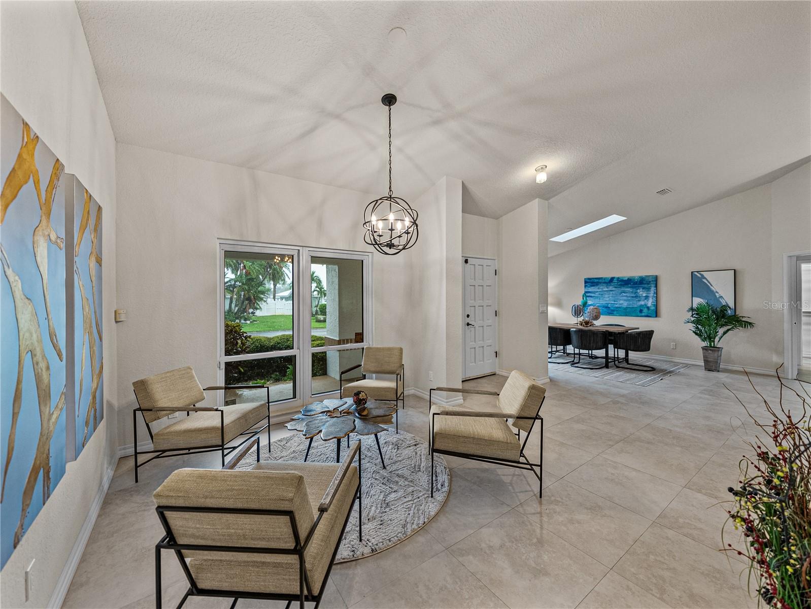 The large profile tiles pair with the high ceilings to even further enhance the open feeling of the rooms.