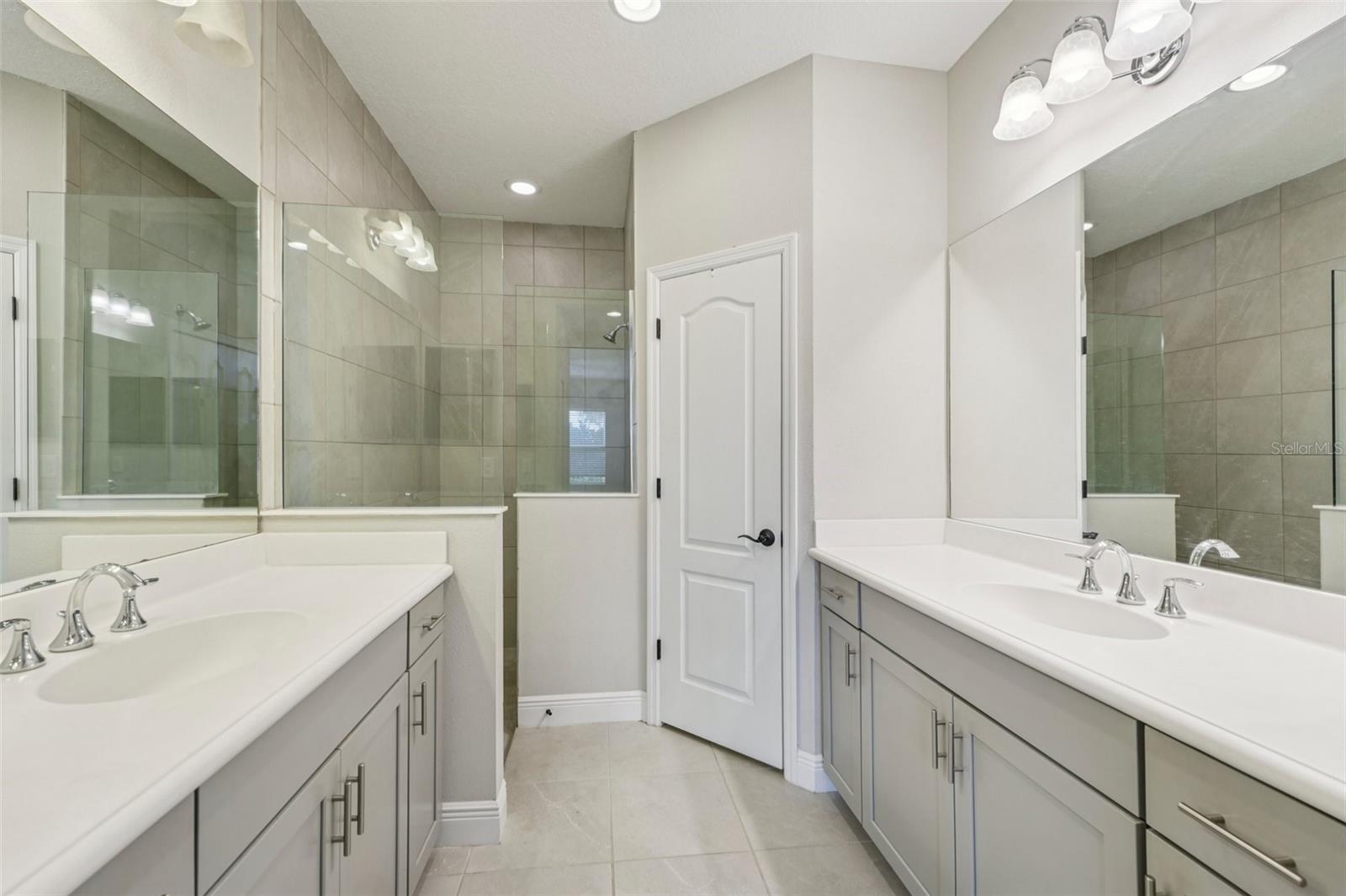 DUAL VANITY IN THE PRIMARY BATHROOM