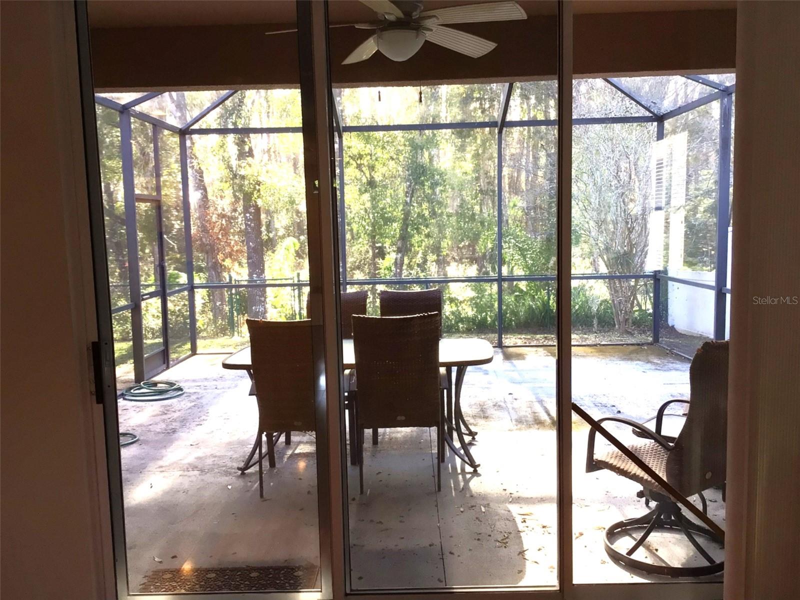 COVERED SCREENED LANAI WITH CONSERVATION VIEWS.