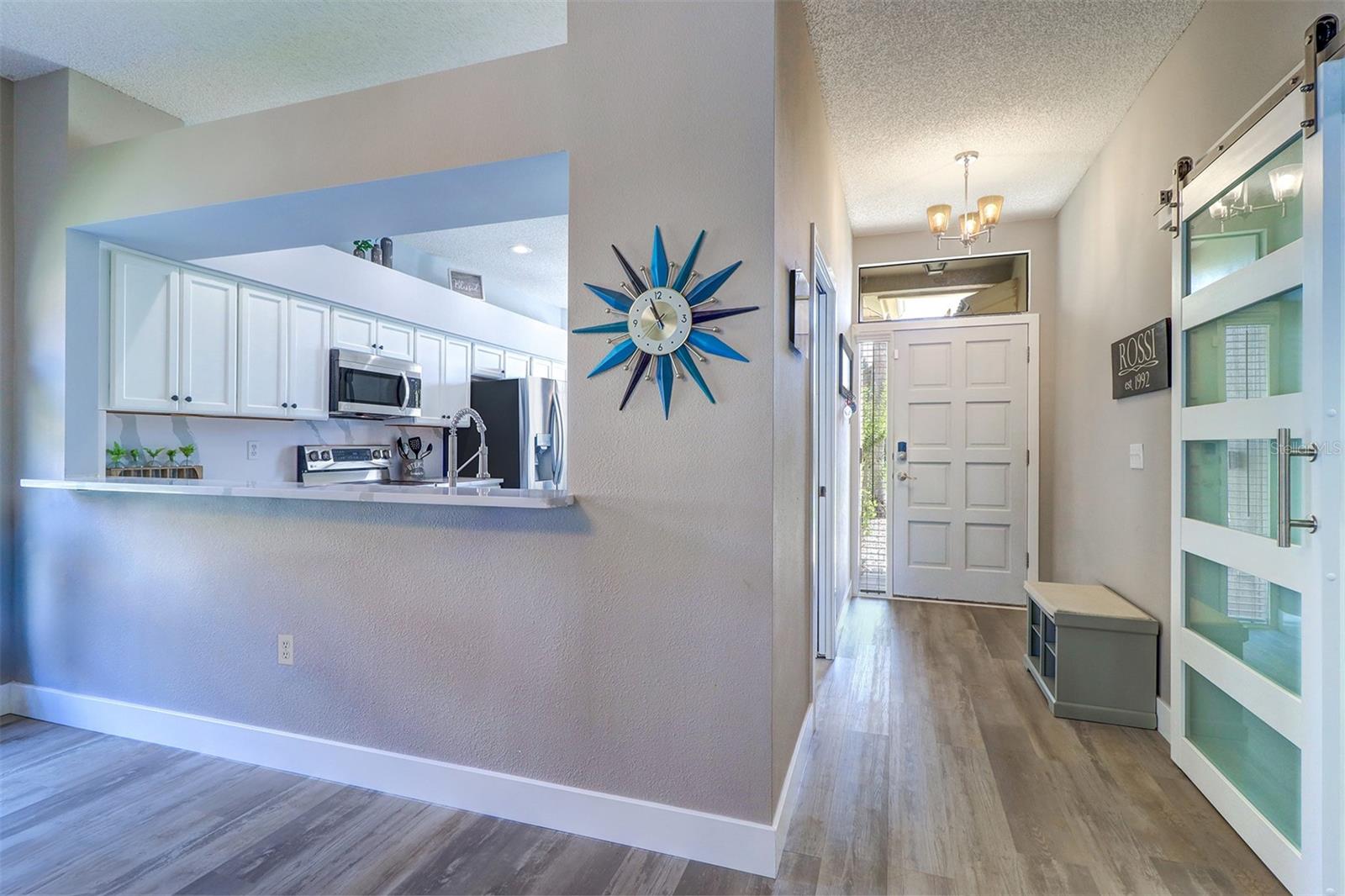 Entry/foyer with view into kitchen