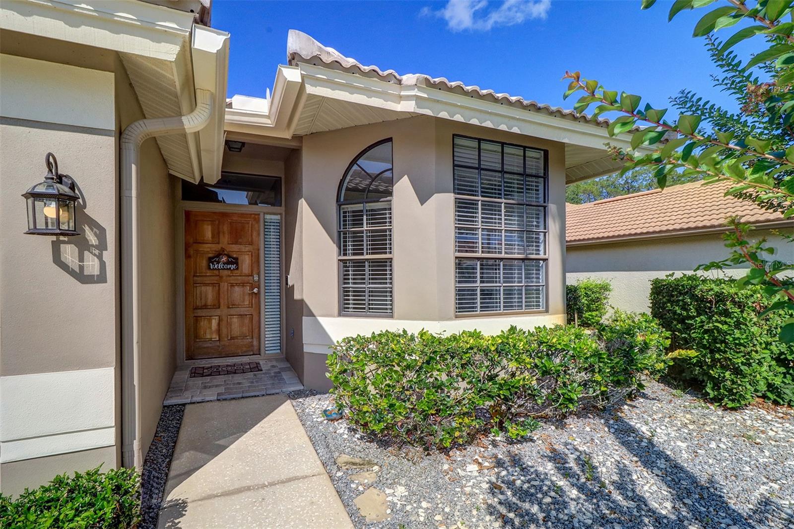 Front door and kitchen bay window