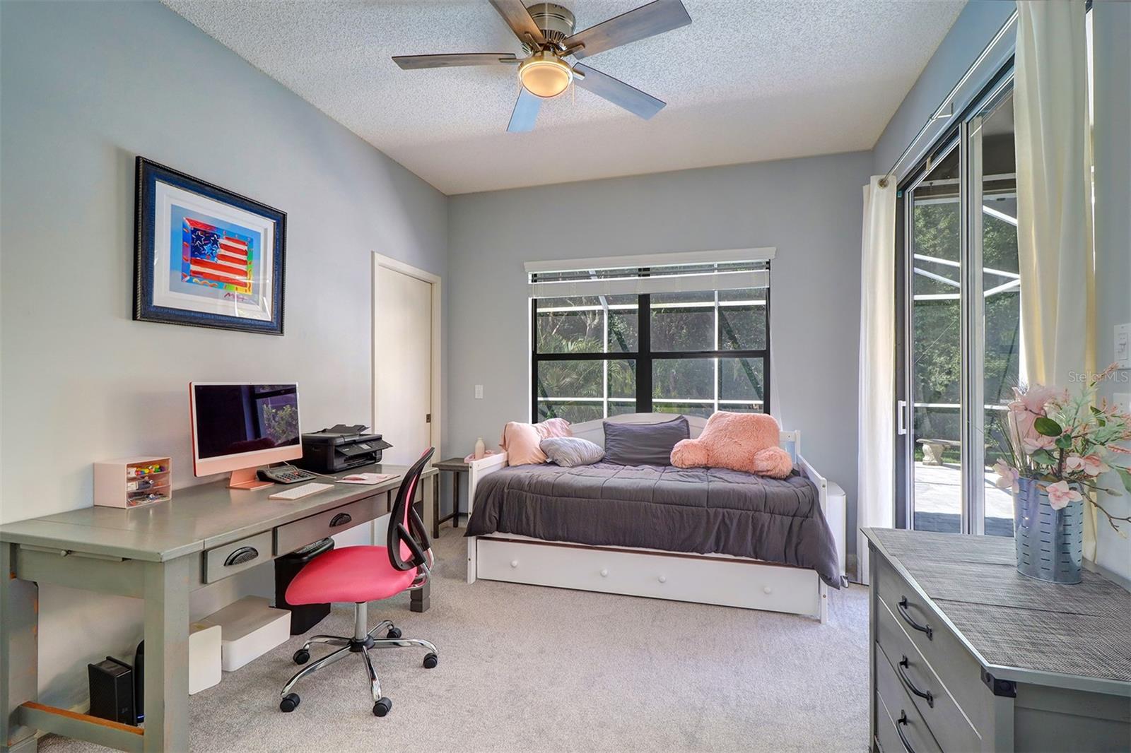 Third (3rd) bedroom or office/den 15.3 x 11.0 with built-in closet and slider to covered lanai and large window overlooking pool