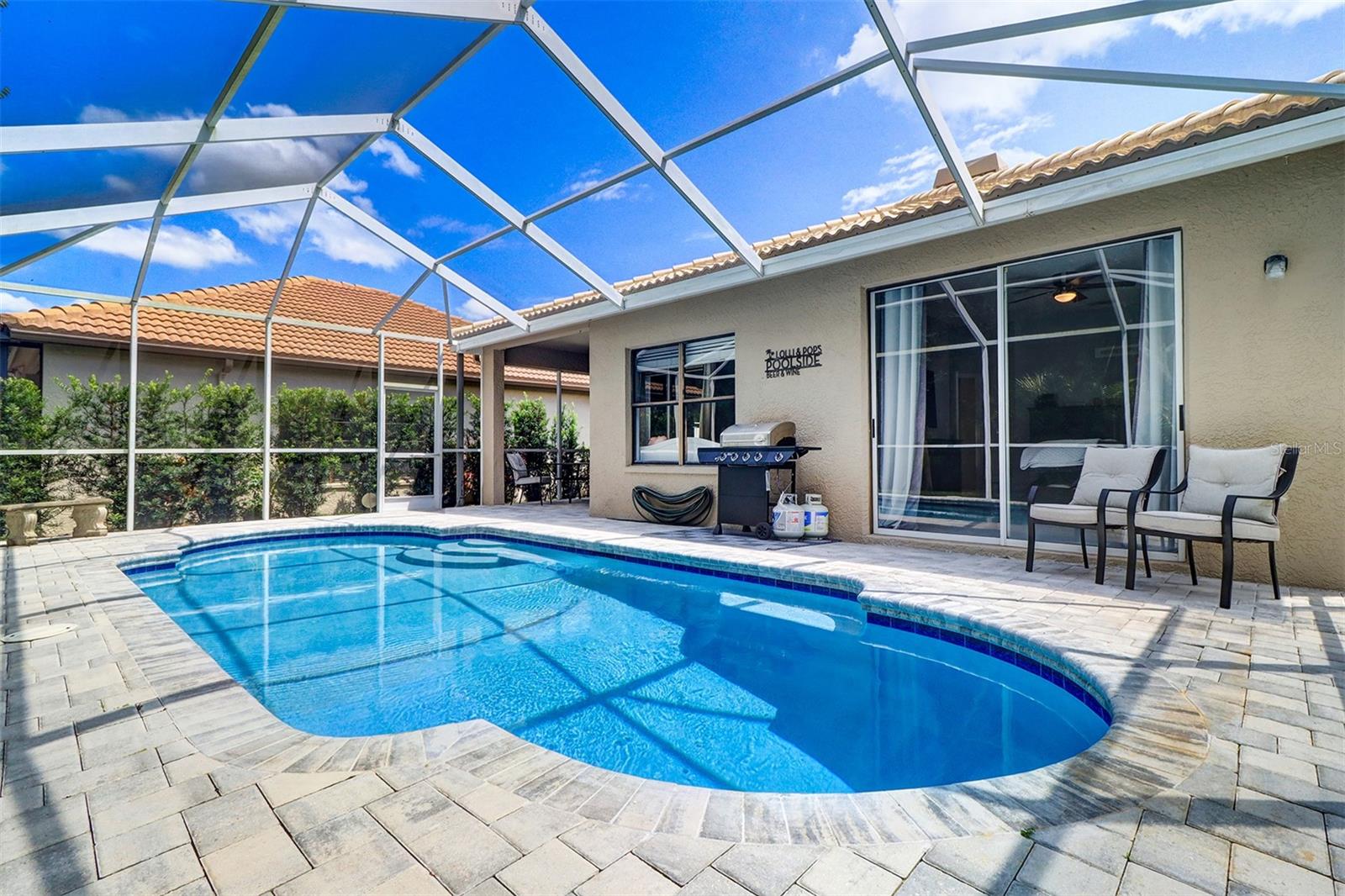 Decking, pool and view of the back of the residence