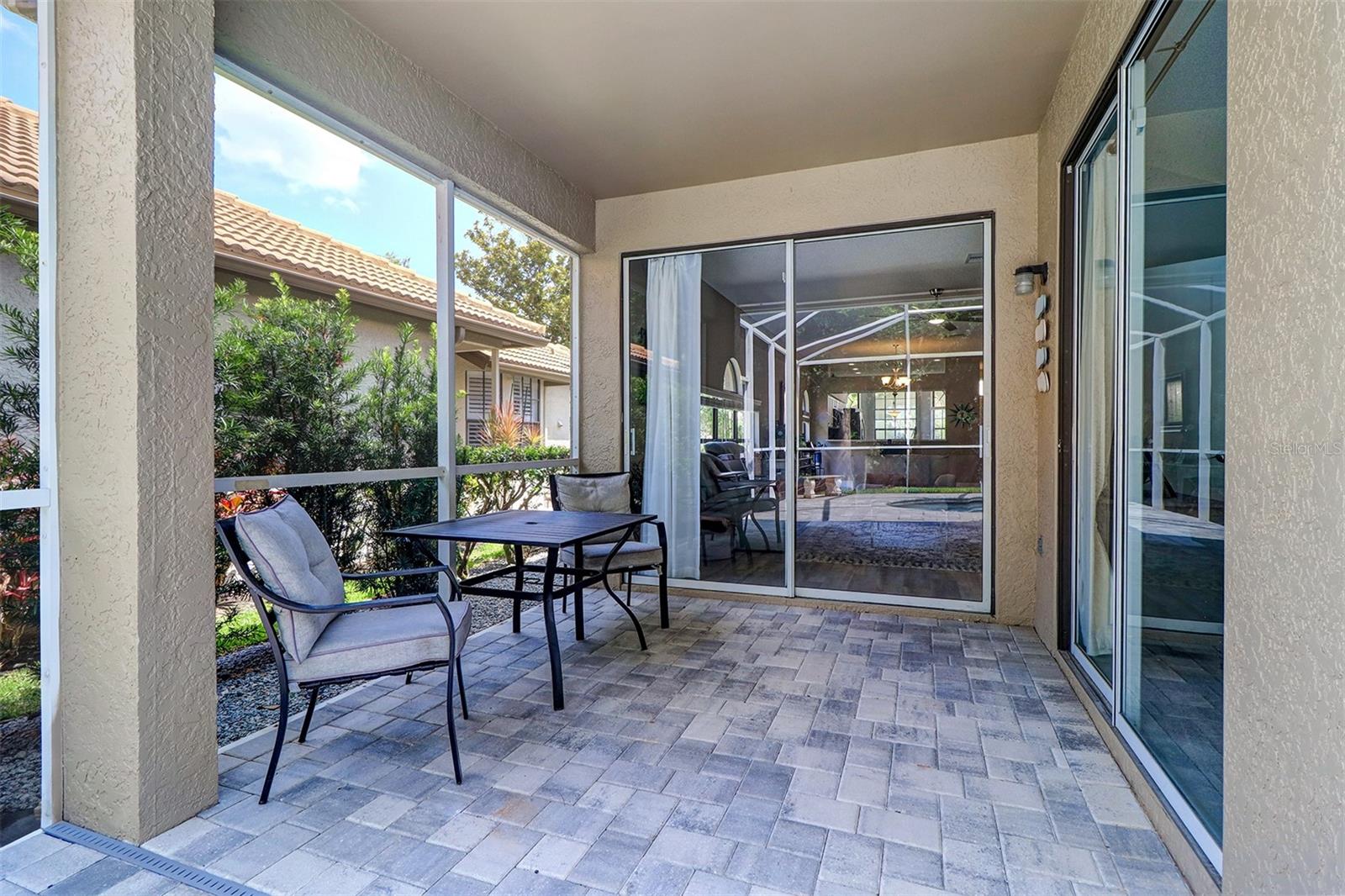 Covered lanai area off of living room and 3rd bedroom