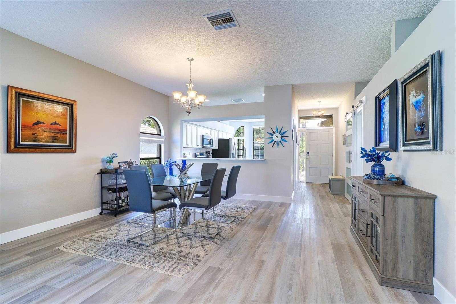 Dining room, entry/foyer and partial kitchen view