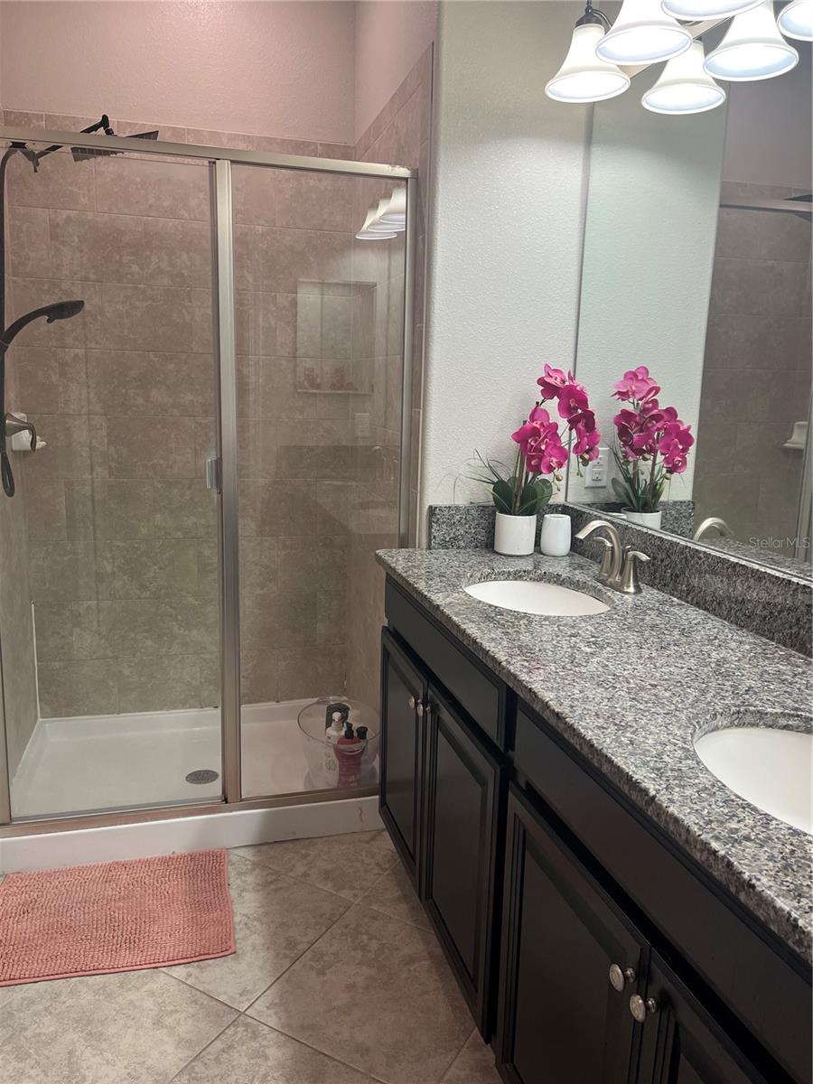 Double sinks, water closet and shower in Primary bath