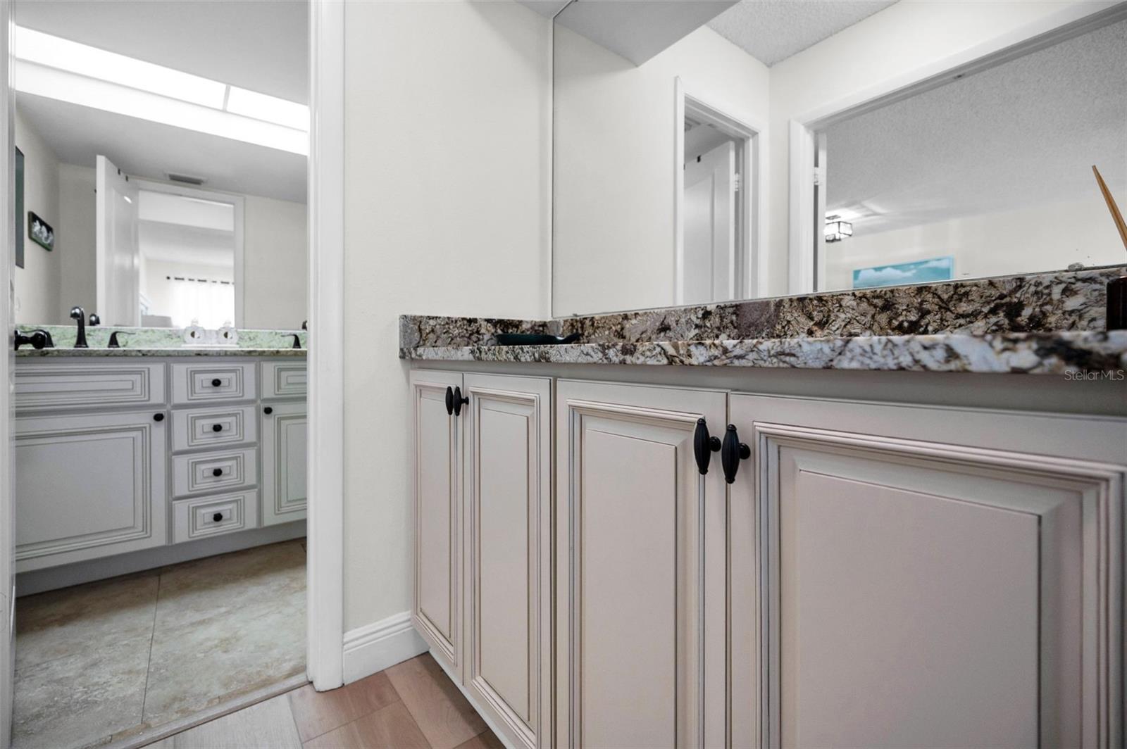 Primary ensuite bathroom with vanity area