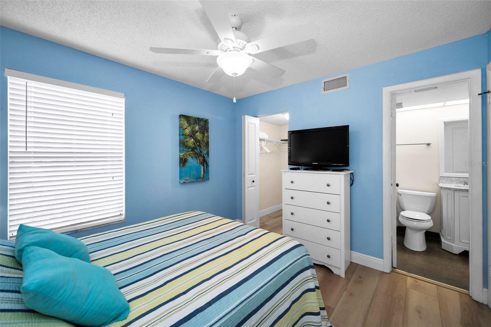 second bedroom with second ensuite bathroom and walk in closet