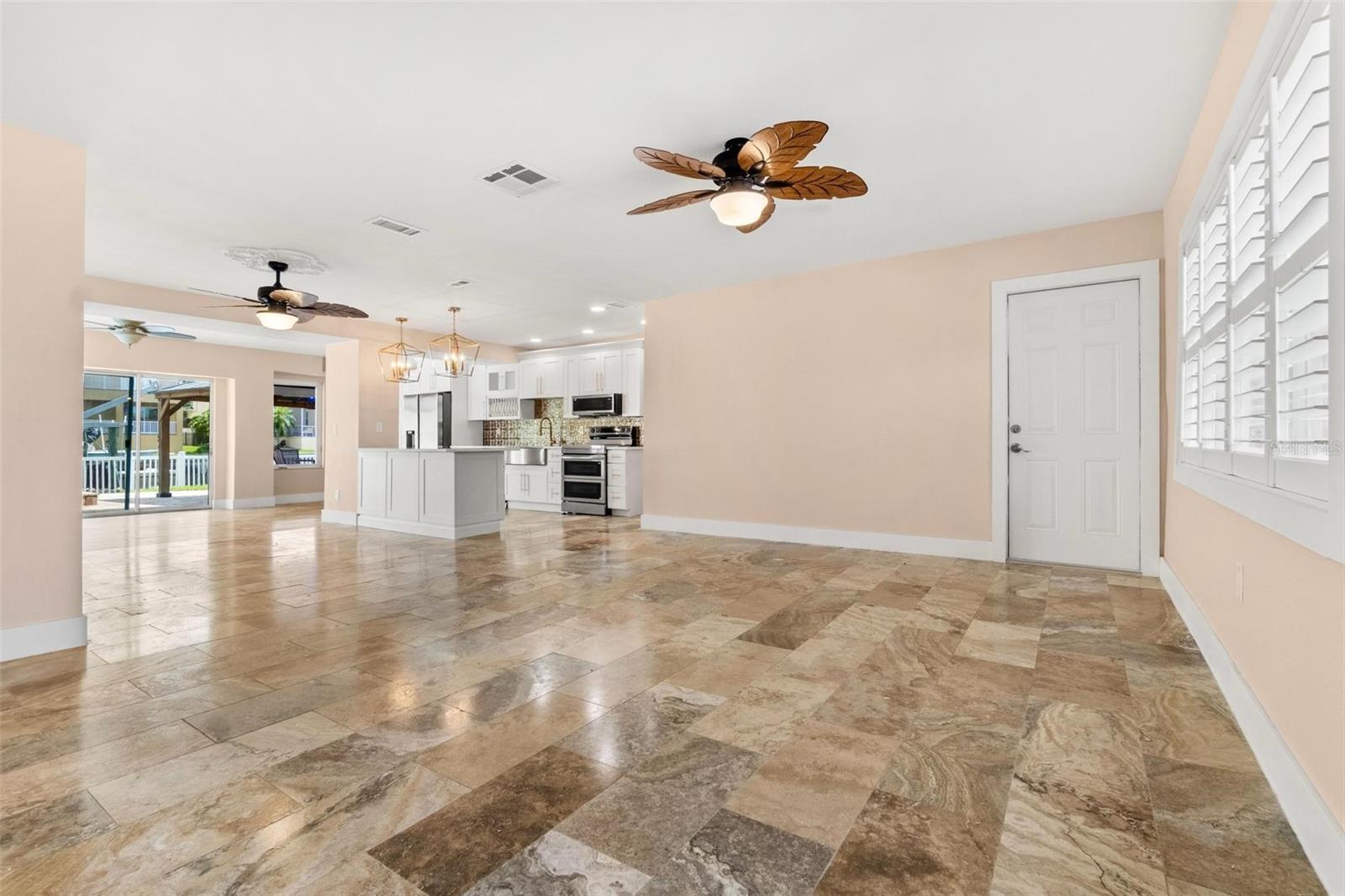 Large Open Floor Plan with View of Water and Pool