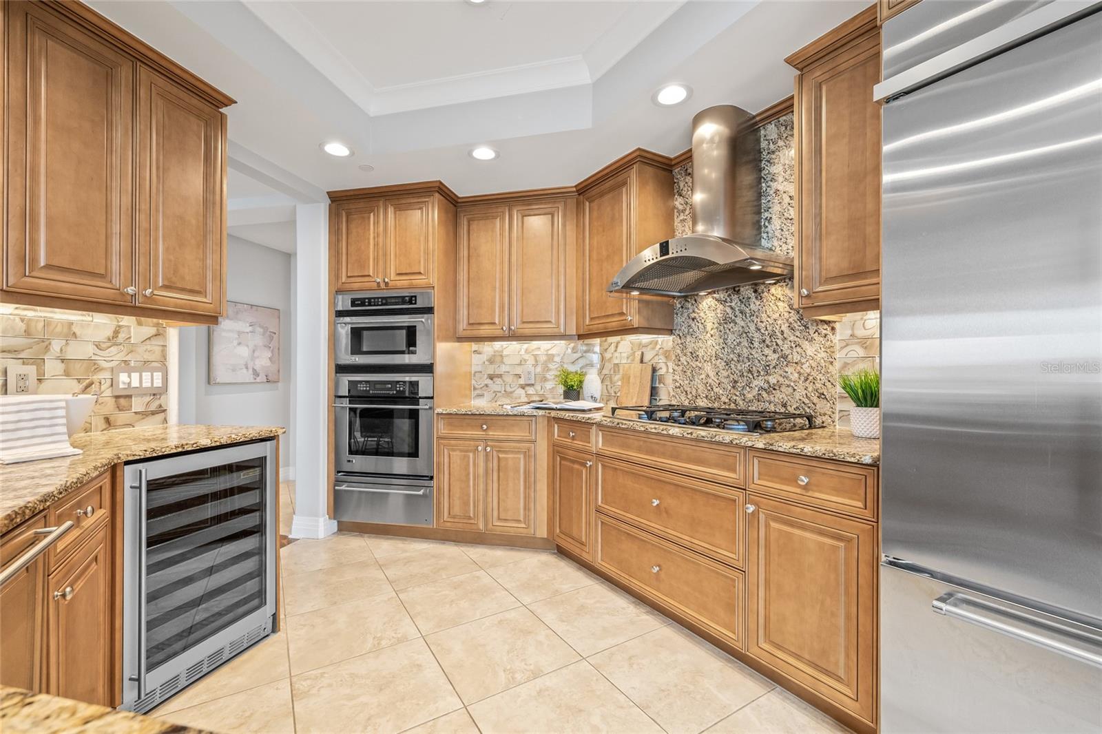 Sleek appliances and built-in beverage fridge.