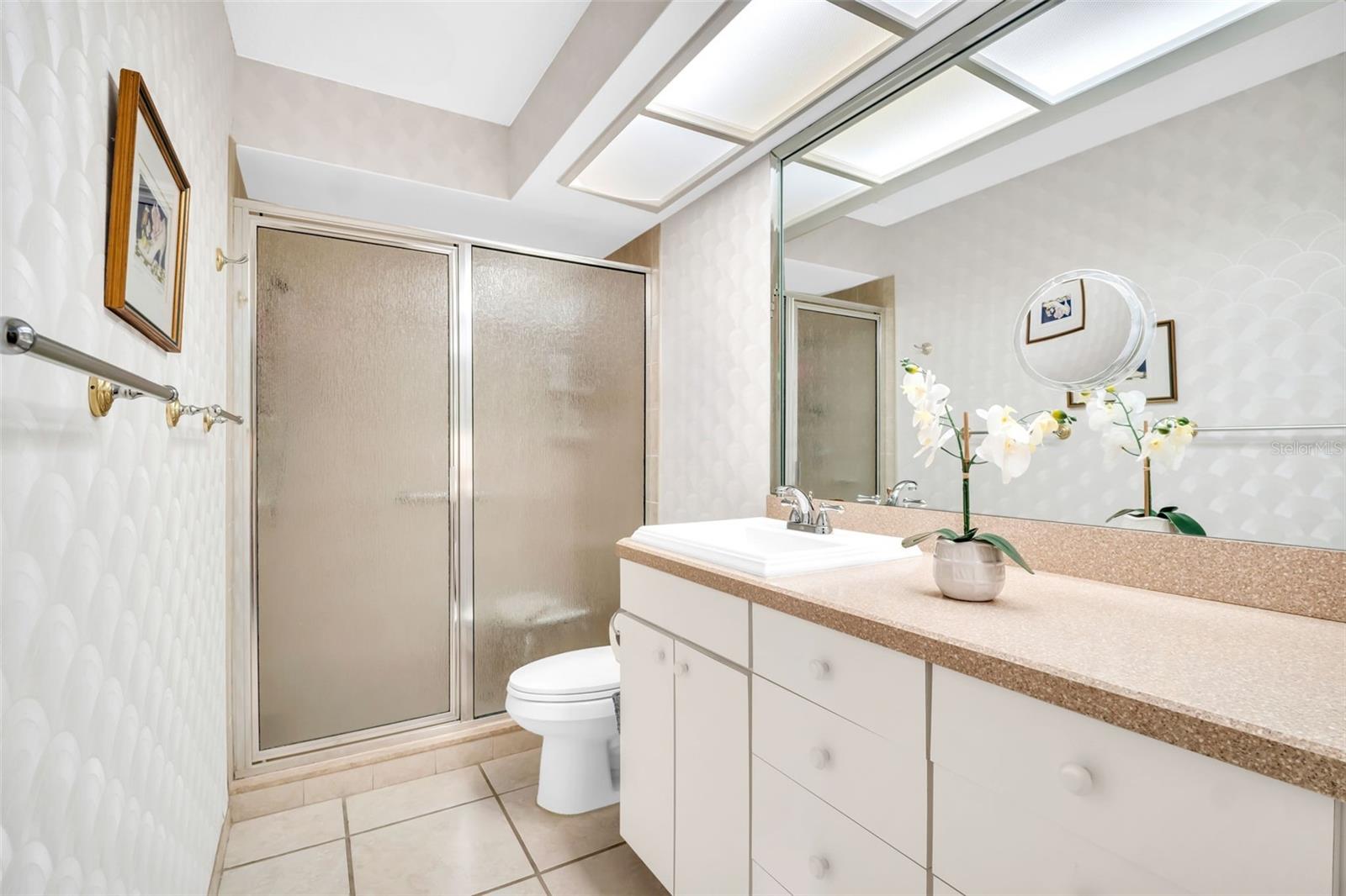 Master en-suite with oversized vanity & gracious walk-in shower~