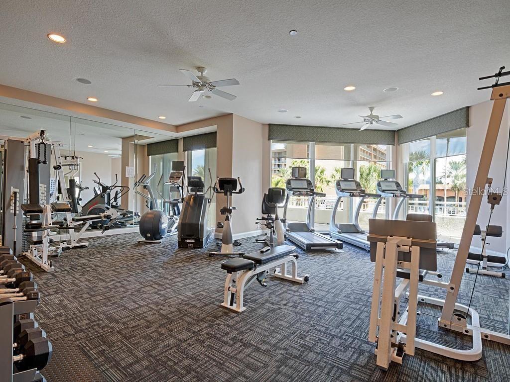 Fitness room with free weights, a barre and pilates room