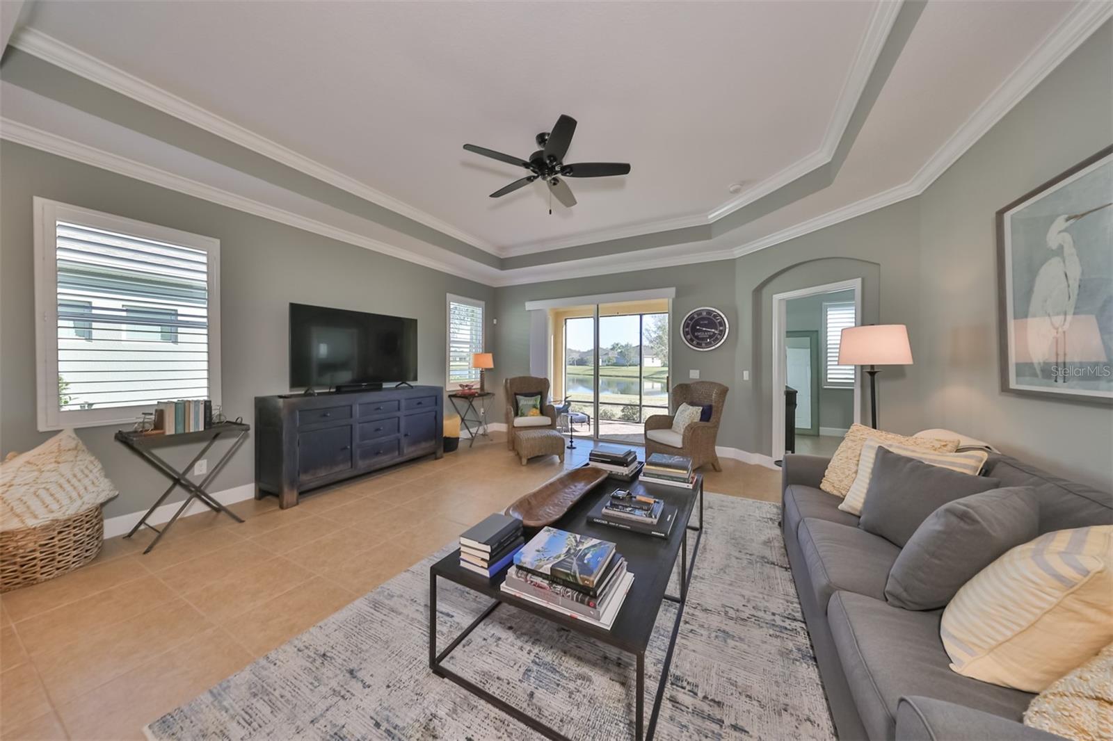Sliding glass doors with additional windows offer beautiful lighting with a gorgeous water view.  The arched doorways, crown molding and trey ceilings are not found in a lot of the villas.