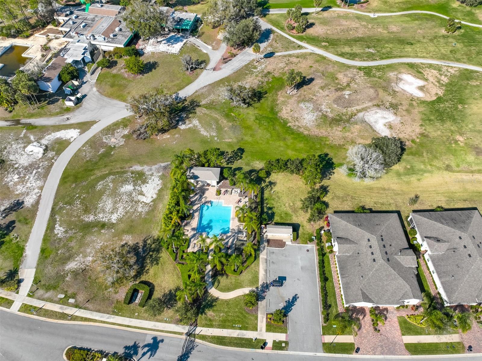 Ariel view of the Verona private pool resort area, which is located at the gated entrance of the community.  This villa is across the street and to the right of this photo.