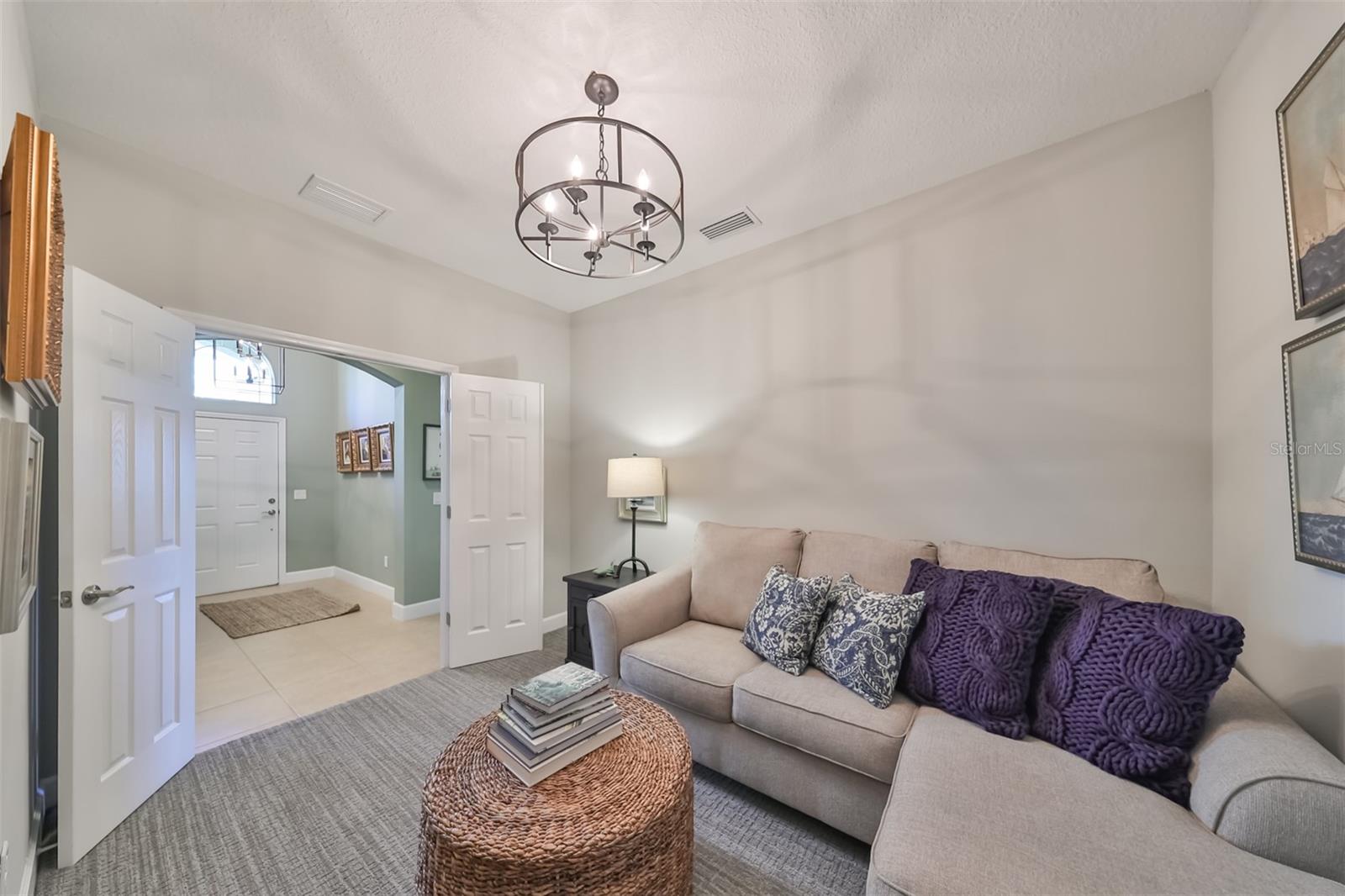 The beautiful French doors add a luxurious feel to the room.  This can be an extra bedroom, office or den.  Cuddle up and enjoy a good book or movie in this extra space.