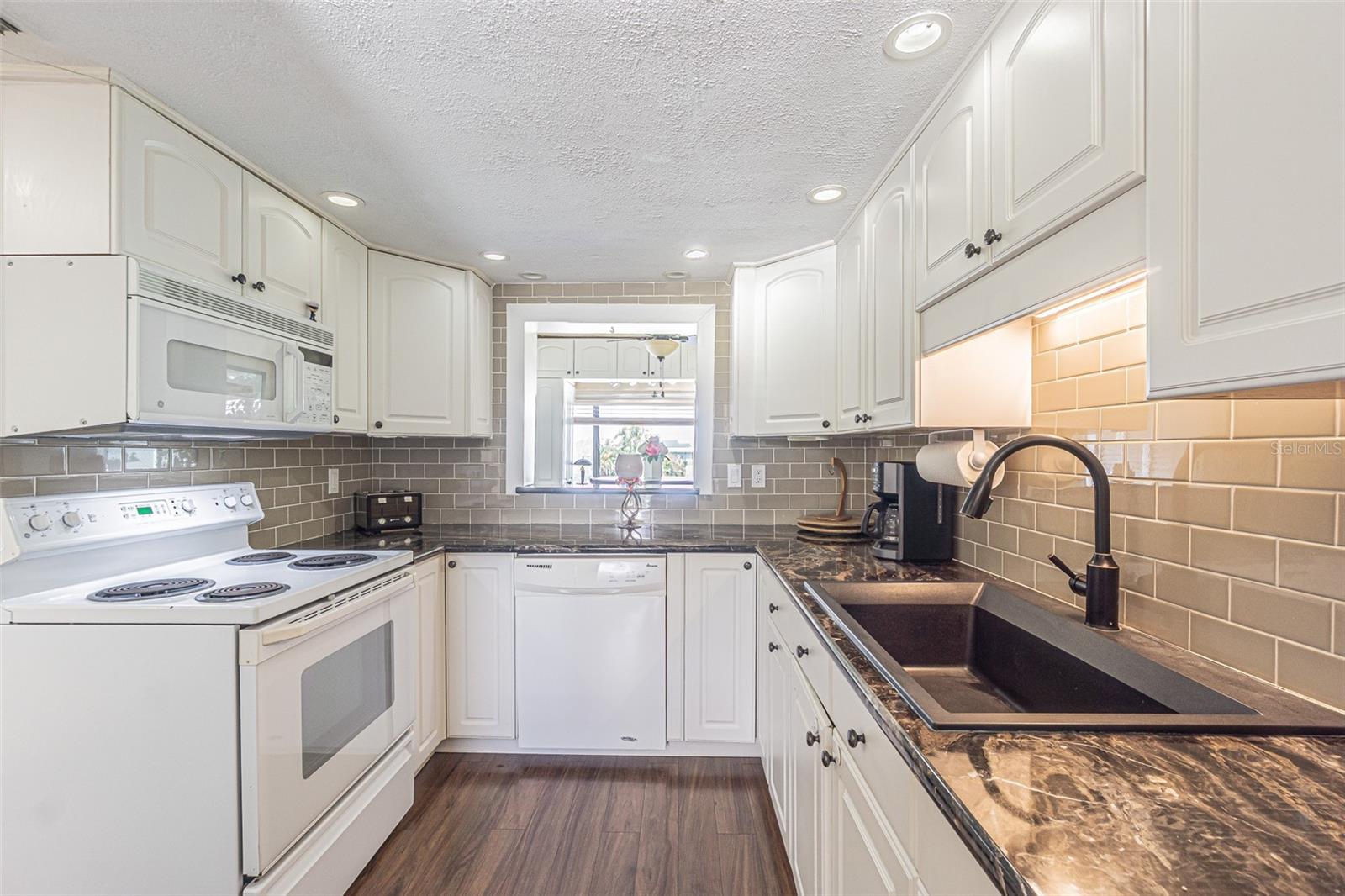 U shaped kitchen with pass thru to bonus area