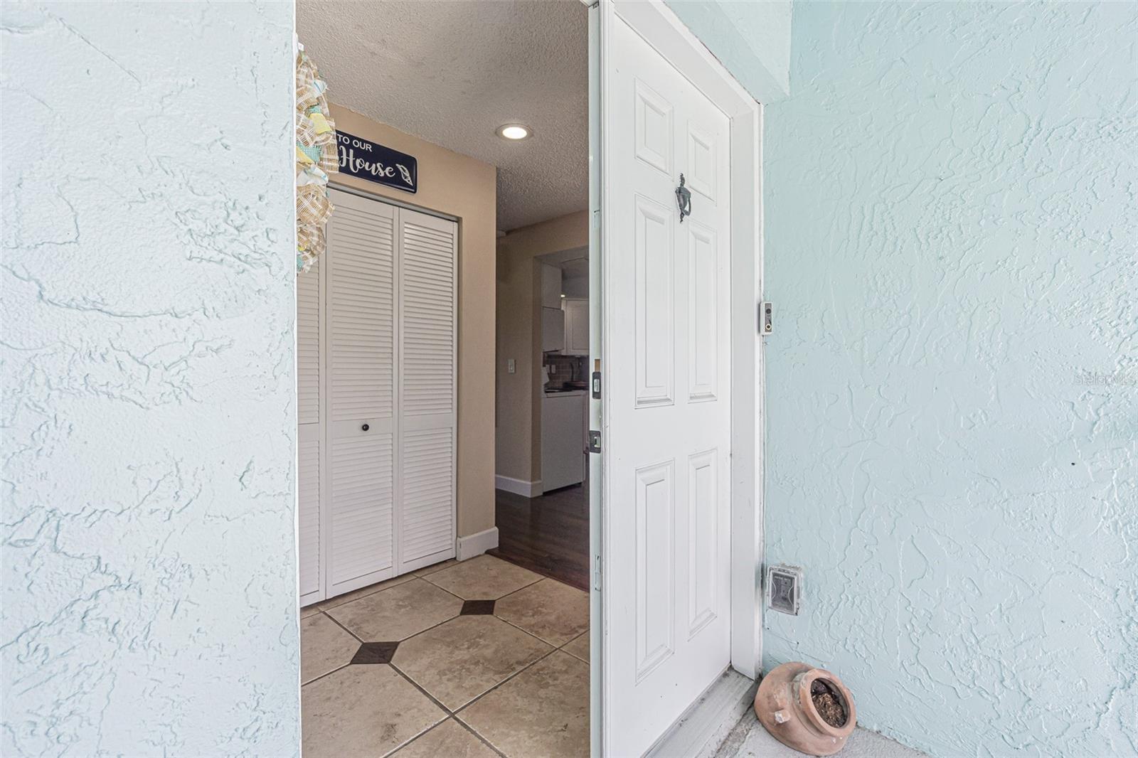 Ceramic tiled floor in Foyer with LARGE utility closet