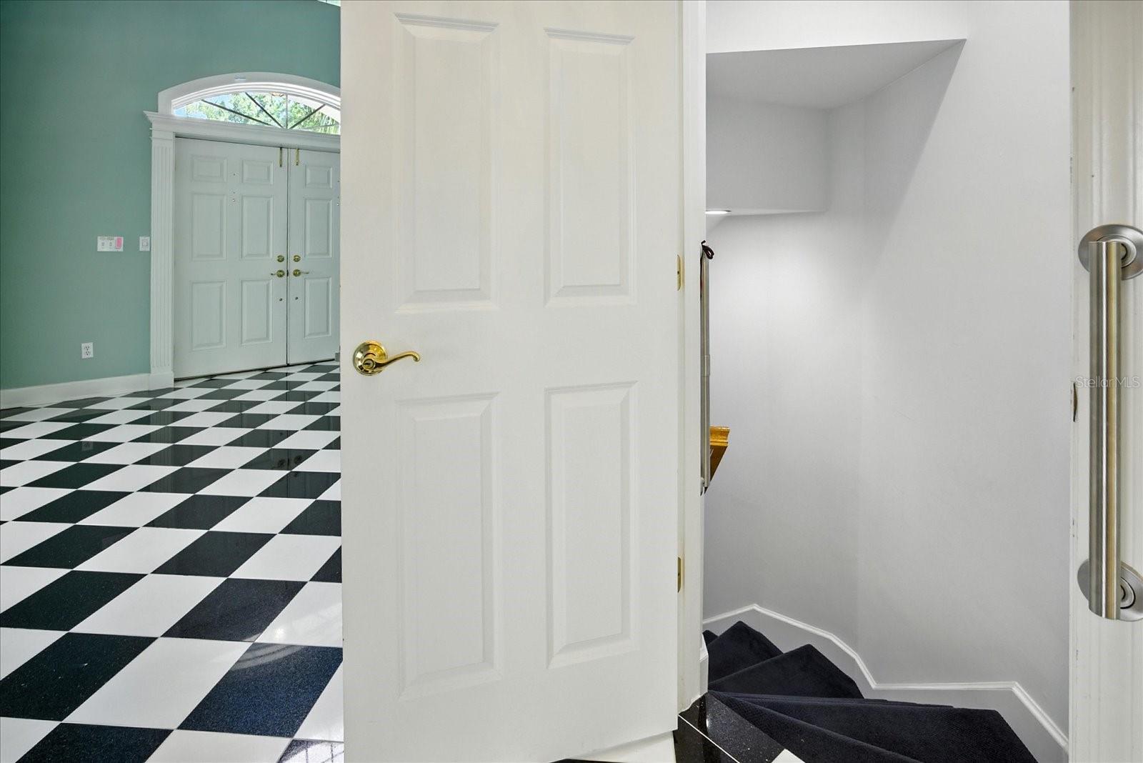 stairwell leading to lower level bonus rooms and 3 car garage